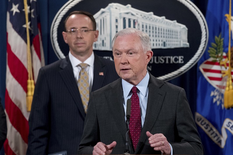 Attorney General Jeff Sessions accompanied by Deputy Attorney General Rod Rosenstein, left, speaks at the Department of Justice, July 20, 2017. CREDIT: AP/Andrew Harnik