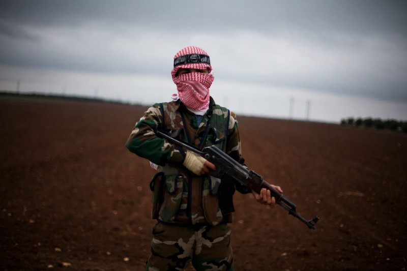 A Free Syrian Army fighter takes position close to a military base, near Azaz, Syria, Monday, Dec. 10, 2012. CREDIT: AP Photo/Manu Brabo