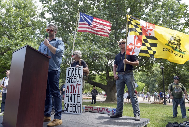 Right-wing writer Mike Cernovich speaks at a June rally. CREDIT: AP Photo/Susan Walsh