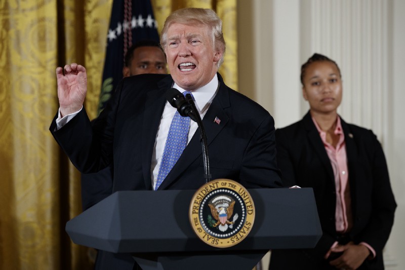 Capitol Hill police officers David Bailey, left, and Crystal Griner listen as President Donald Trump speaks in the East Room of the White House in Washington, Thursday, July 27, 2017, during a ceremony to recognize the first responders from the June 14 Congressional baseball shooting. CREDIT: AP Photo/Evan Vucci