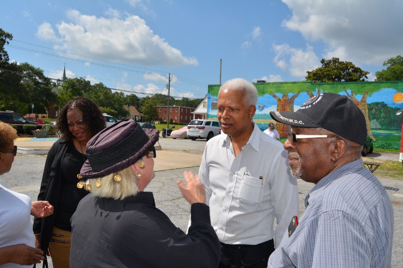 Rep. Hank Johnson (D-GA) speaks to constituents in Clarkston. CREDIT: Kira Lerner