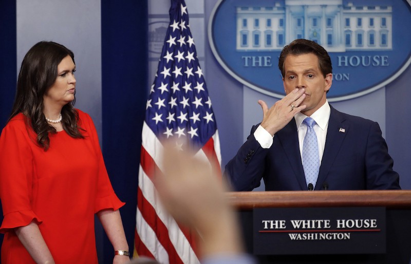 Sarah Huckabee Sanders watches as incoming White House communications director Anthony Scaramucci blows a kiss after answering questions during the press briefing in the Brady Press Briefing room of the White House in Washington, Friday, July 21, 2017. CREDIT: Pablo Martinez Monsivais
