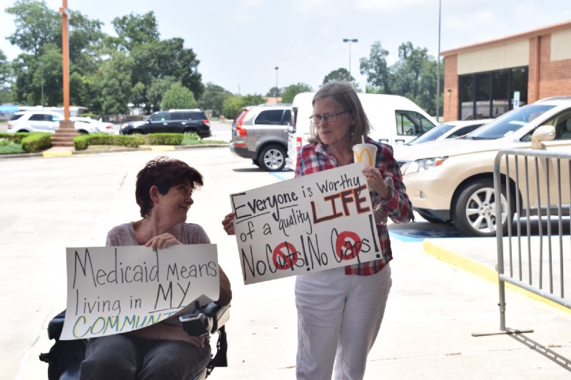 Sharon Hennessey & Carol McGovern said they were not going inside the town hall because they did not want to distract from flood relief conversations. CREDIT: ThinkProgress/Amanda Gomez