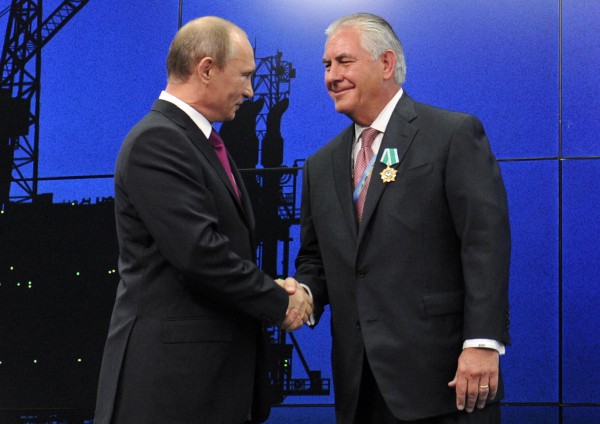 Putin presents Tillerson with a Russian medal at an award ceremony of heads and employees of energy companies in 2012. CREDIT: Mikhail Klimentyev/Sputnik, Kremlin Pool Photo via AP