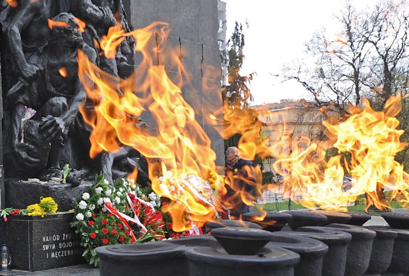A man stands at the Warsaw Ghetto Heroes memorial. CREDIT: AP/Alik Keplicz