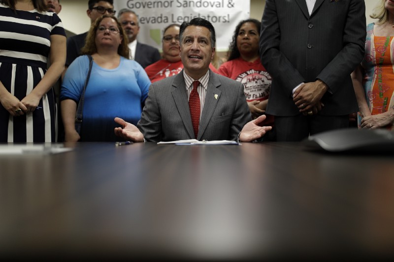 Nevada Gov. Brian Sandoval speaks before signing Senate Bill 539 during a signing ceremony Thursday, June 15, 2017, in North Las Vegas, Nev. The bill aims to force America’s three insulin manufacturers to annually turn over the prices they set and profits they make on insulin. CREDIT: AP Photo/John Locher