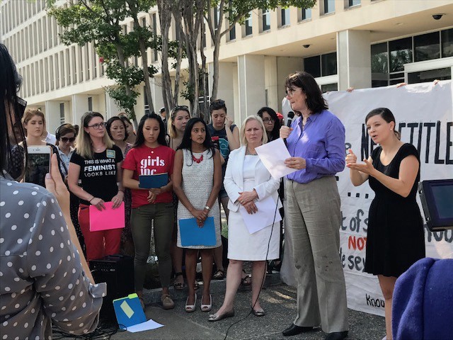 Mara Kiesling speaking to a crowd gathered at the U.S. Department of Education, alongside Sen. Kirsten Gillibrand (D-NY) and Vanita Gupta, former head of the civil rights division at the U.S. Department of Justice. CREDIT: ThinkProgress/Casey Quinlan