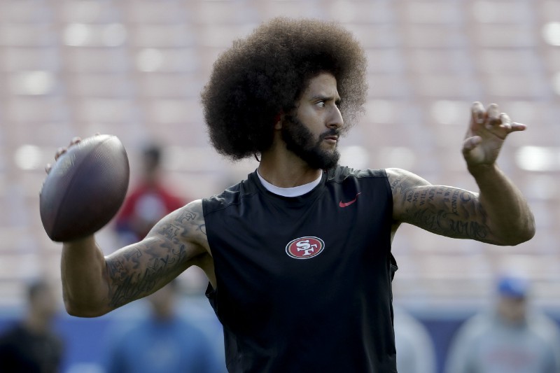 San Francisco 49ers quarterback Colin Kaepernick warms up before an NFL football game against the Los Angeles Rams Saturday, Dec. 24, 2016, in Los Angeles. CREDIT: AP Photo/Rick Scuteri