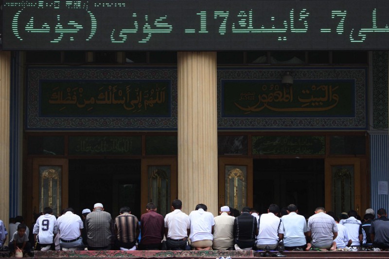 Uighur (also Uyghur) ethnic minority worshipers take part in Friday noon prayers in Urumqi, the capital of Xinjiang province in China in 2009. CREDIT: AP Photo/Elizabeth Dalziel