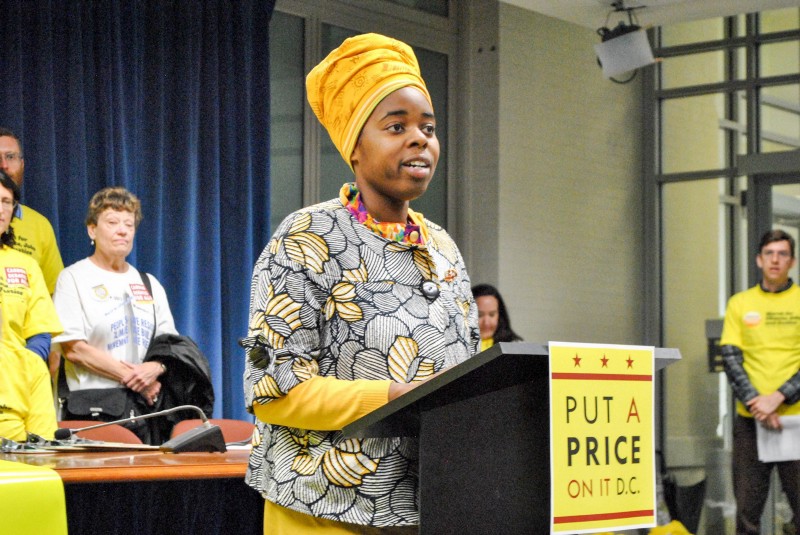 Jessica Wynter Martin, a Washington, D.C., activist, speaks out on behalf of a carbon fee-and-rebate policy for the District. CREDIT: Chesapeake Climate Action Network