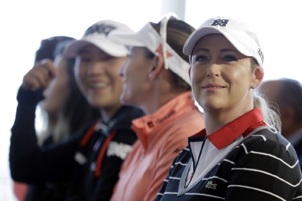 Professional golfers Lydia Ko, left, of New Zealand, Brittany Lang, center, and Cristie Kerr attend a media event at Trump National Golf Club. CREDITL AP Photo/Julio Cortez