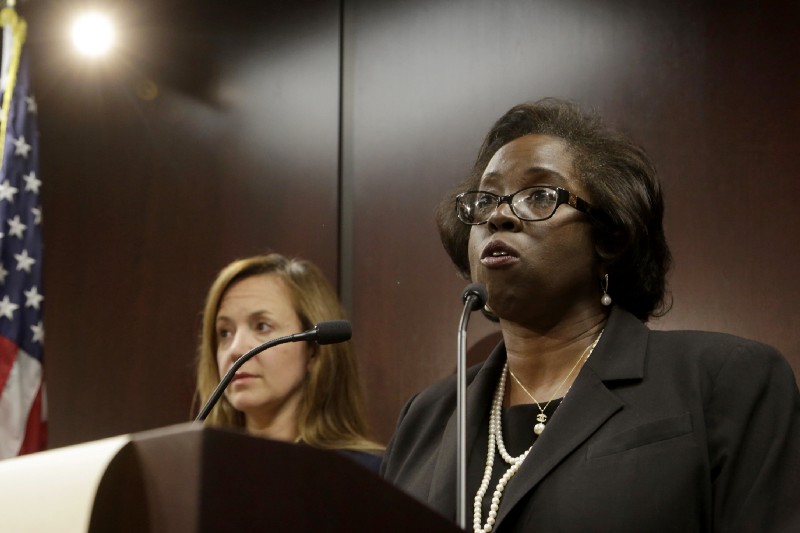 Special prosecutor Patricia Brown Holmes announces conspiracy charges against three Chicago police officers for their alleged cover-up of the truth about a 2014 on-duty killing. CREDIT: AP Photo/G-Jun Yam