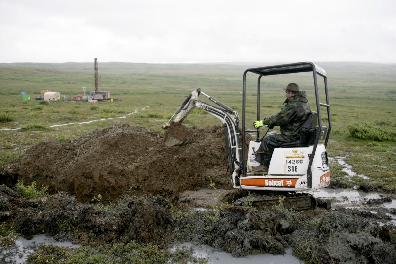 A Pebble Mine project worker test drills in the Bristol Bay region of Alaska. CREDIT: AP Photo/Al Grillo