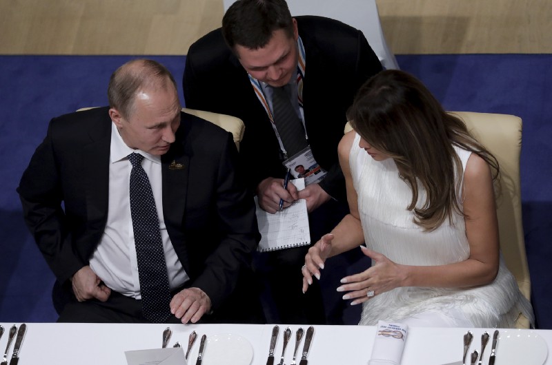 A picture of Putin (left) speaking with Melania Trump at the G20 dinner, shortly before his previously undisclosed conversation with Donald Trump CREDIT: Kay Nietfeld/pool photo via AP