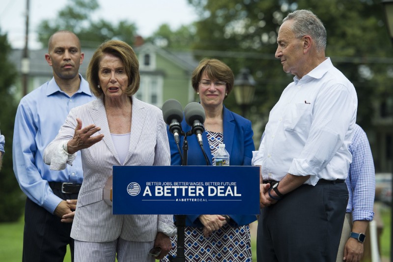 House Minority Leader Nancy Pelosi (D-CA), with Rep. Hakeem Jeffries (D-NY), Sen. Amy Klobuchar (D-MN), and Senate Minority Leader Chuck Schumer (D-NY) in Berryville, VA. CREDIT: AP Photo/Cliff Owen
