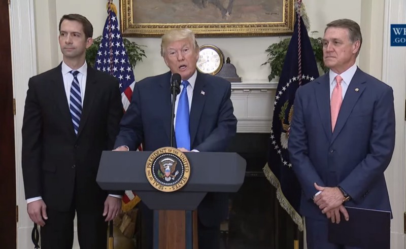 President Donald Trump, Sens. Tom Cotton (R-AR) and David Perdue (R-GA) announcing the introduction of an immigration bill at the White House. CREDIT: Screengrab