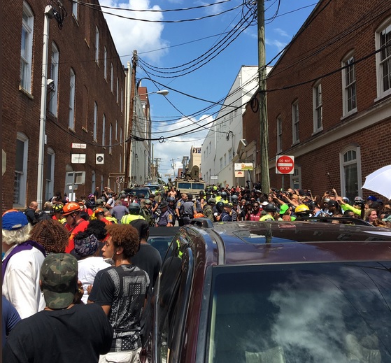 Chaos erupted at the scene of a hit-and-run in Charlottesville on Saturday, when witnesses say a grey sedan deliberately struck at least six protesters after riot police dispersed a white supremacist rally. CREDIT: ThinkProgress/Joshua Eaton