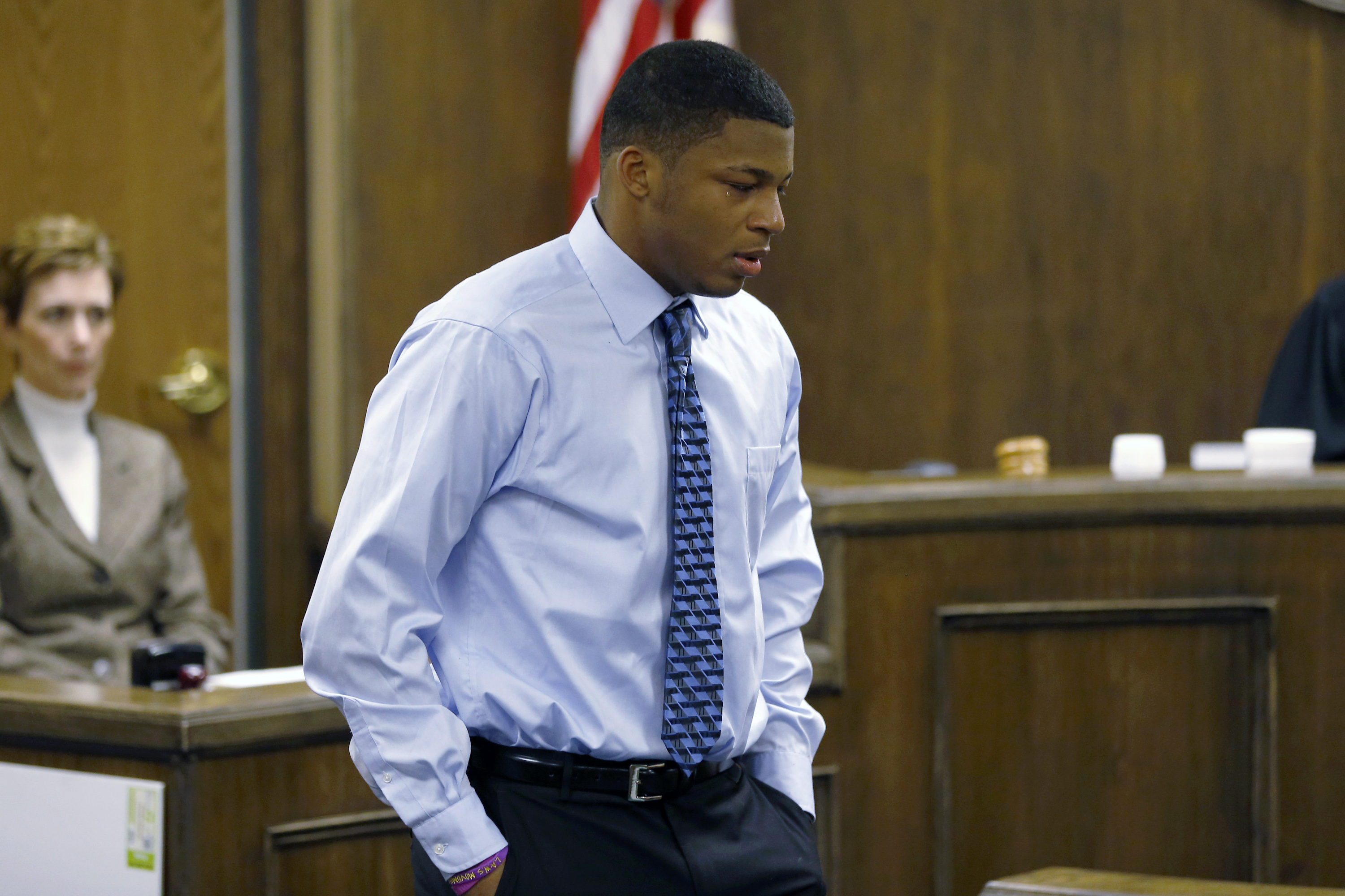 Ma'Lik Richmond walks towards the victim and her family to apologize after he and co-defendant Trent Mays were found delinquent on rape and other charges after their trial in juvenile court in Steubenville, Ohio on Sunday, March 17, 2013. Mays and Richmond were accused of raping a 16-year-old West Virginia girl in August, 2012. (AP Photo/Keith Srakocic, Pool)