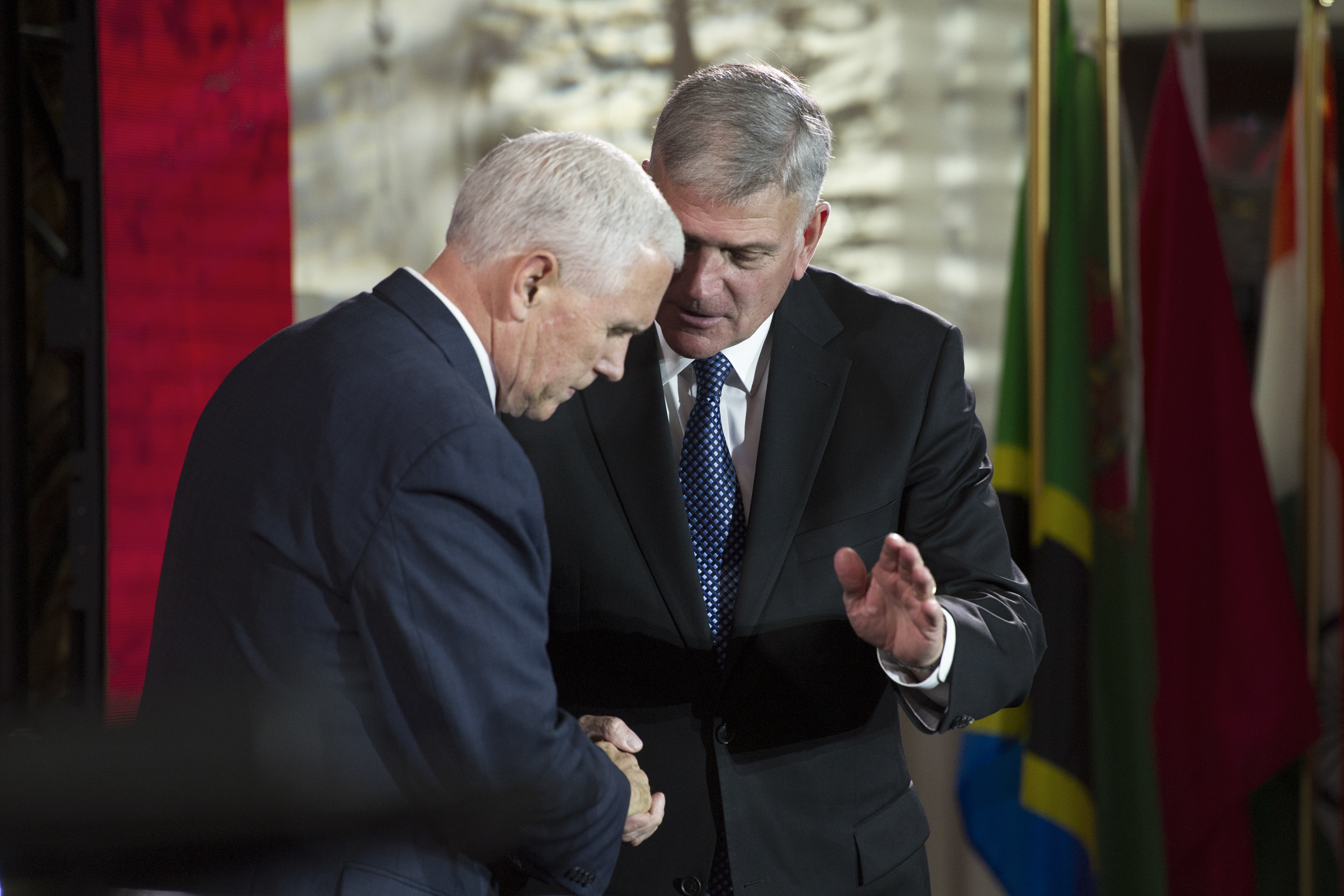 Vice President Mike Pence speaks with Franklin Graham after addressing the World Summit in Defense of Persecuted Christians which is hosted by Graham, and the Billy Graham Evangelistic Association in May. CREDIT: AP/Cliff Owen