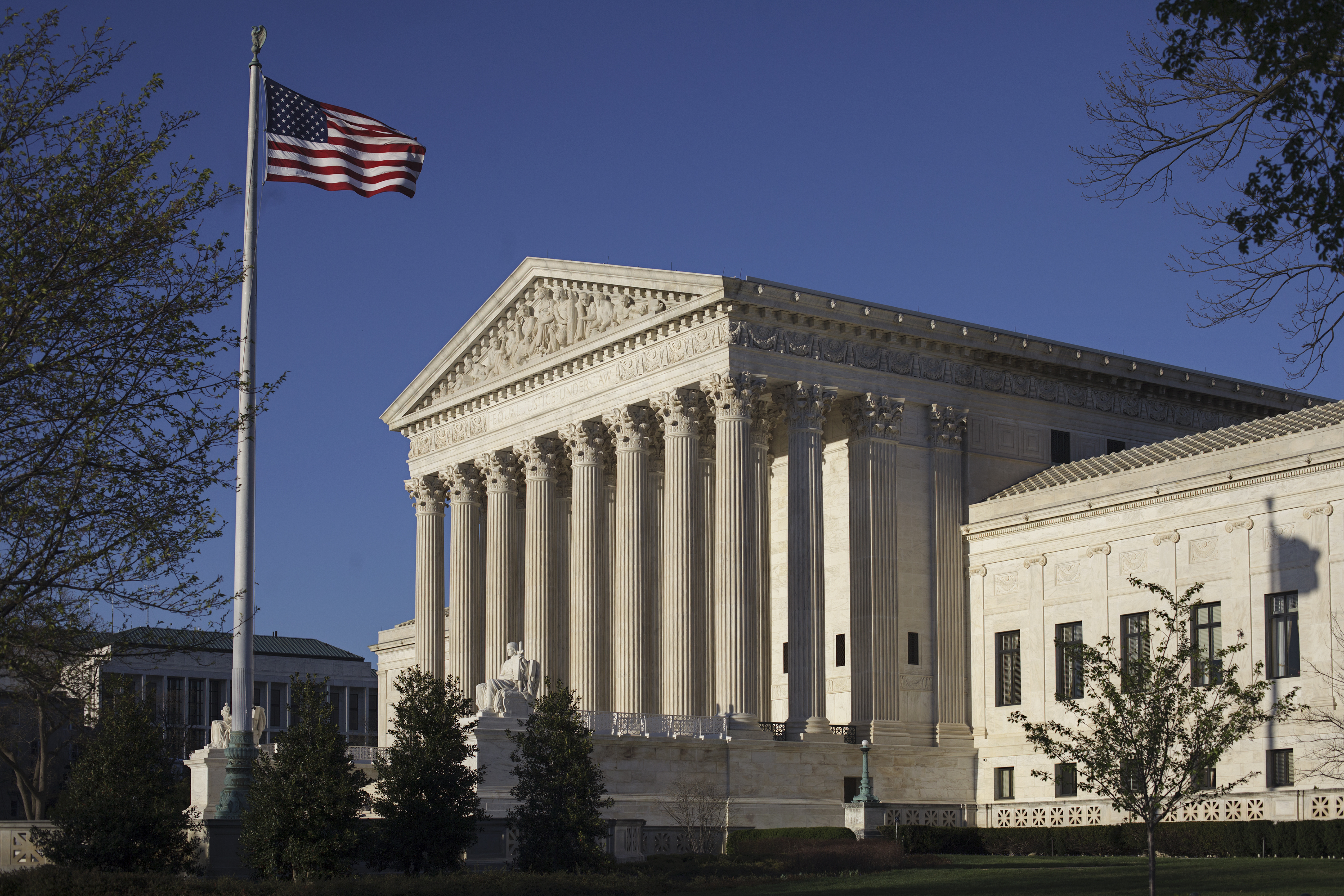 FILE In this April 4, 2017 file photo, the Supreme Court in Washington. A unanimous Supreme Court on Monday, June 12, 2017, struck down part of an unusual immigration law that treats fathers and mothers differently when it comes to conferring citizenship on children born outside the U.S. (AP Photo/J. Scott Applewhite)