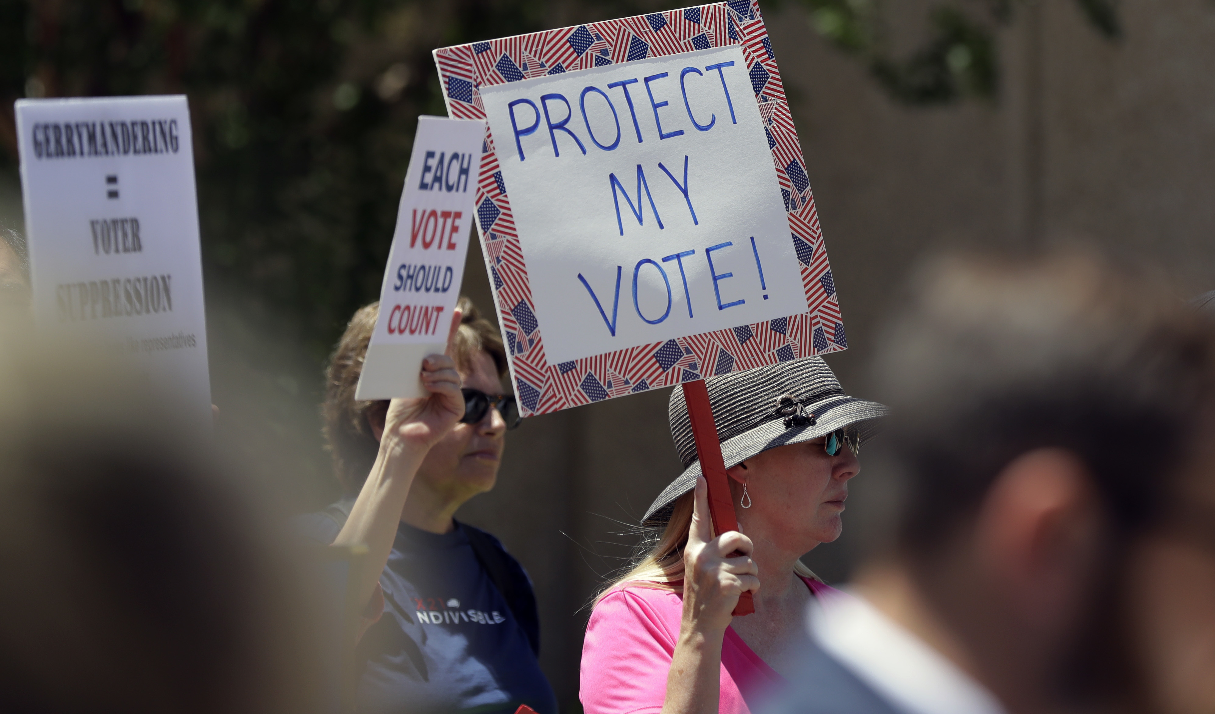Protesters gather outside the federal court house, Monday, July 10, 2017, in San Antonio. CREDIT: AP Photo/Eric Gay
