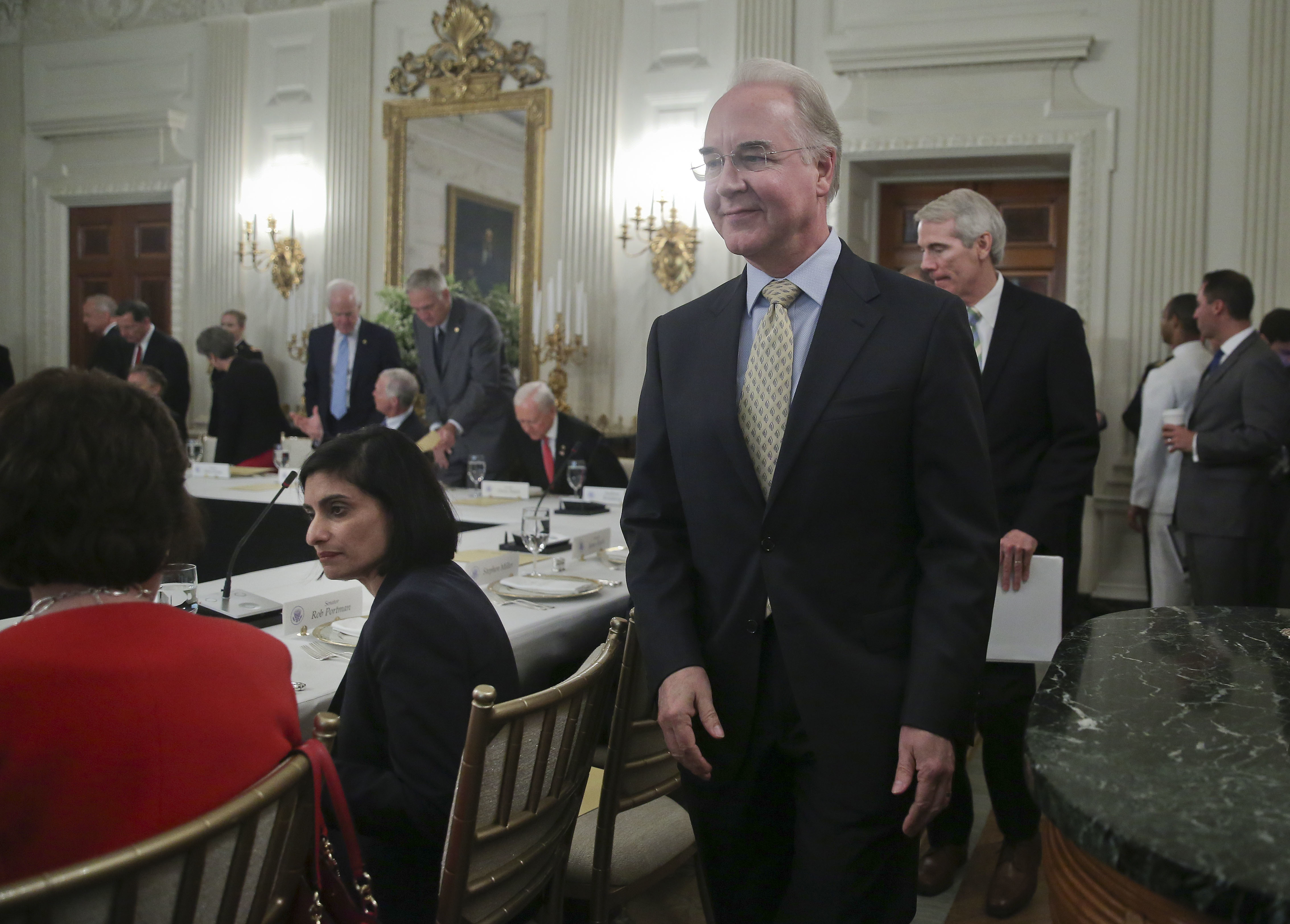 Health and Human Services Secretary Tom Price, center, followed by Sen. Rob Portman, R-Ohio, walk to their seats for a luncheon with President Donald Trump, Wednesday, July 19, 2017, in the State Dinning Room of the White House in Washington. Also seated is Seema Verma, Administrator for Medicare and Medicaid Services, talking with Sen. Susan Collins, R-Maine, far left. (AP Photo/Pablo Martinez Monsivais)