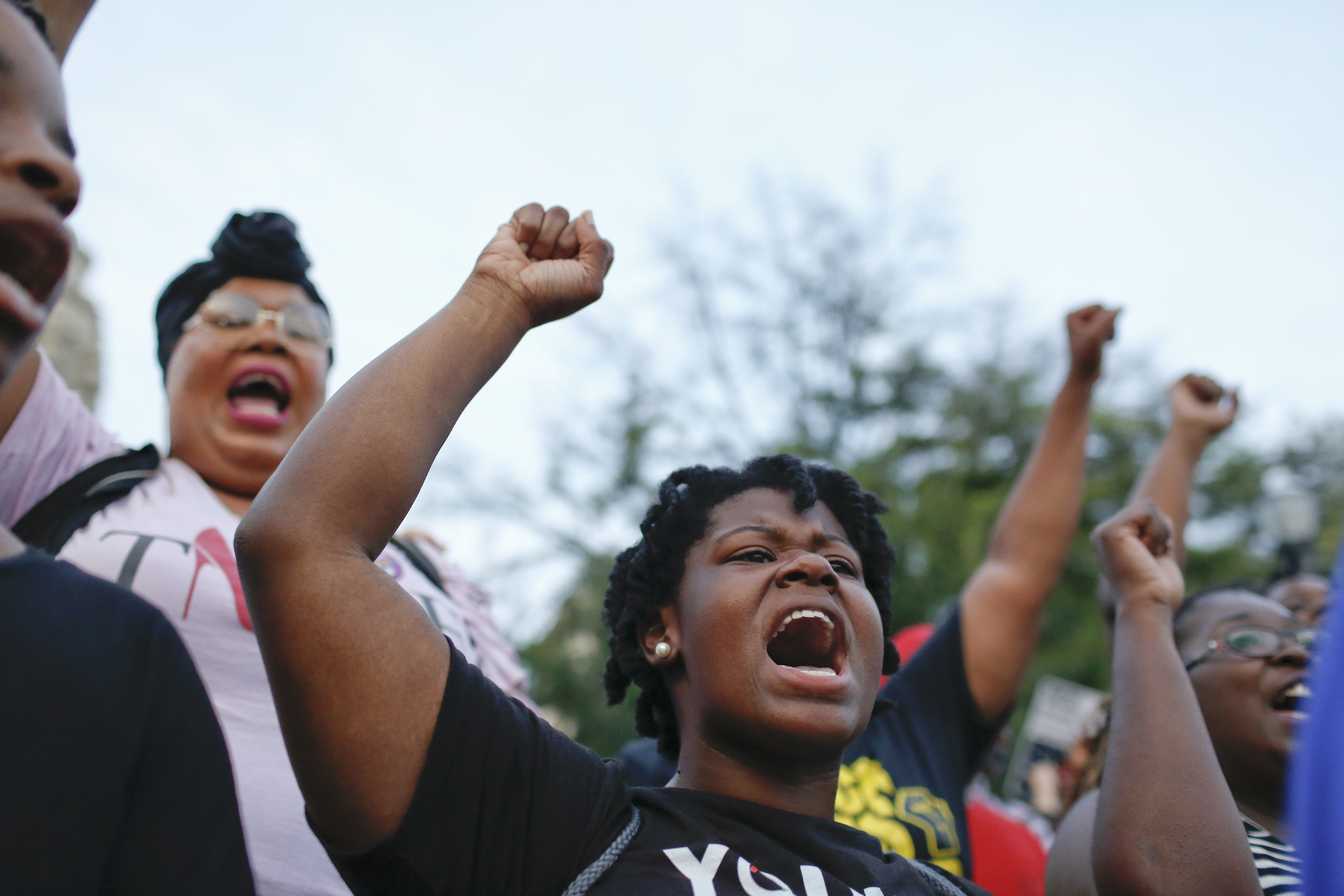 Kayla Smith, front, of Birmingham, Ala., chants during a solidarity rally Sunday, Aug. 13, 2017, in Birmingham for the victims of a white supremacist rally that turned violent in Charlottesville, Va. CREDIT: AP Photo/Brynn Anderson