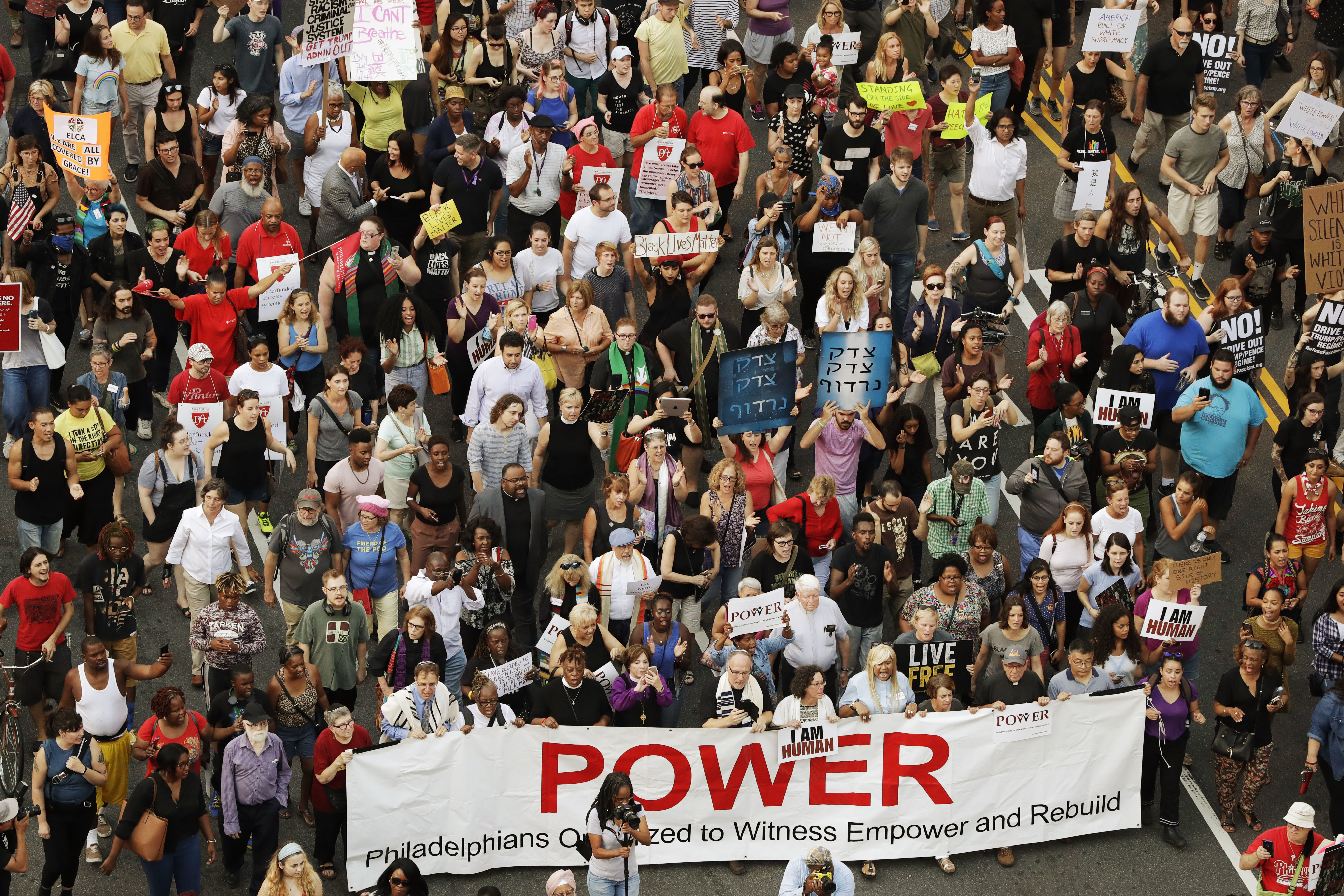 Protesters march down North Broad Street in Philadelphia in response to a white nationalist rally held in Charlottesville, over the weekend. CREDIT: AP Photo/Matt Slocum
