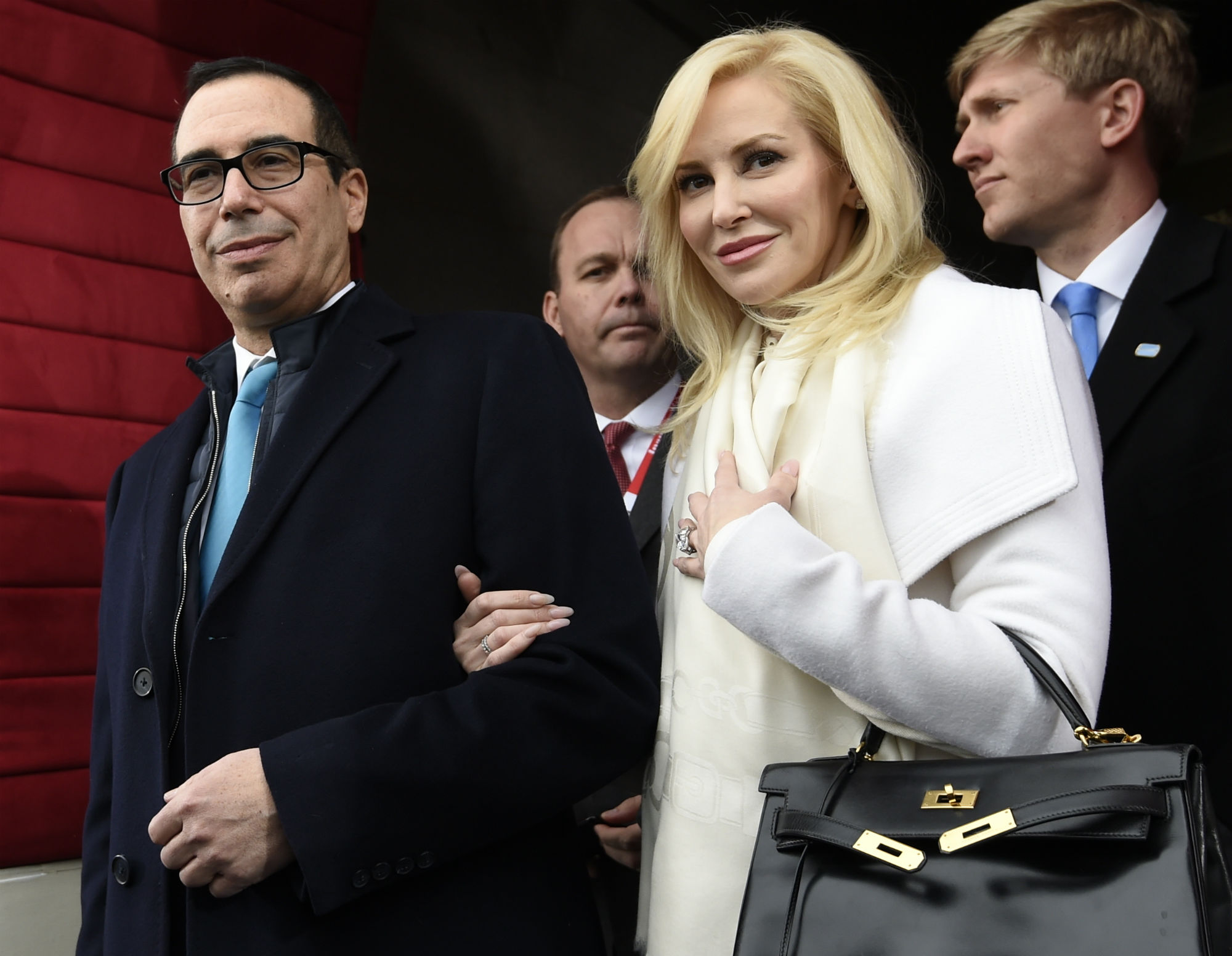 Mnuchin and Linton arrive on Capitol Hill for the presidential inauguration. Linton offered a condescending response to a social media critic on Monday night, telling a mother of three that that she was “adorably out of touch.” CREDIT: Saul Loeb/Pool Photo via AP, File