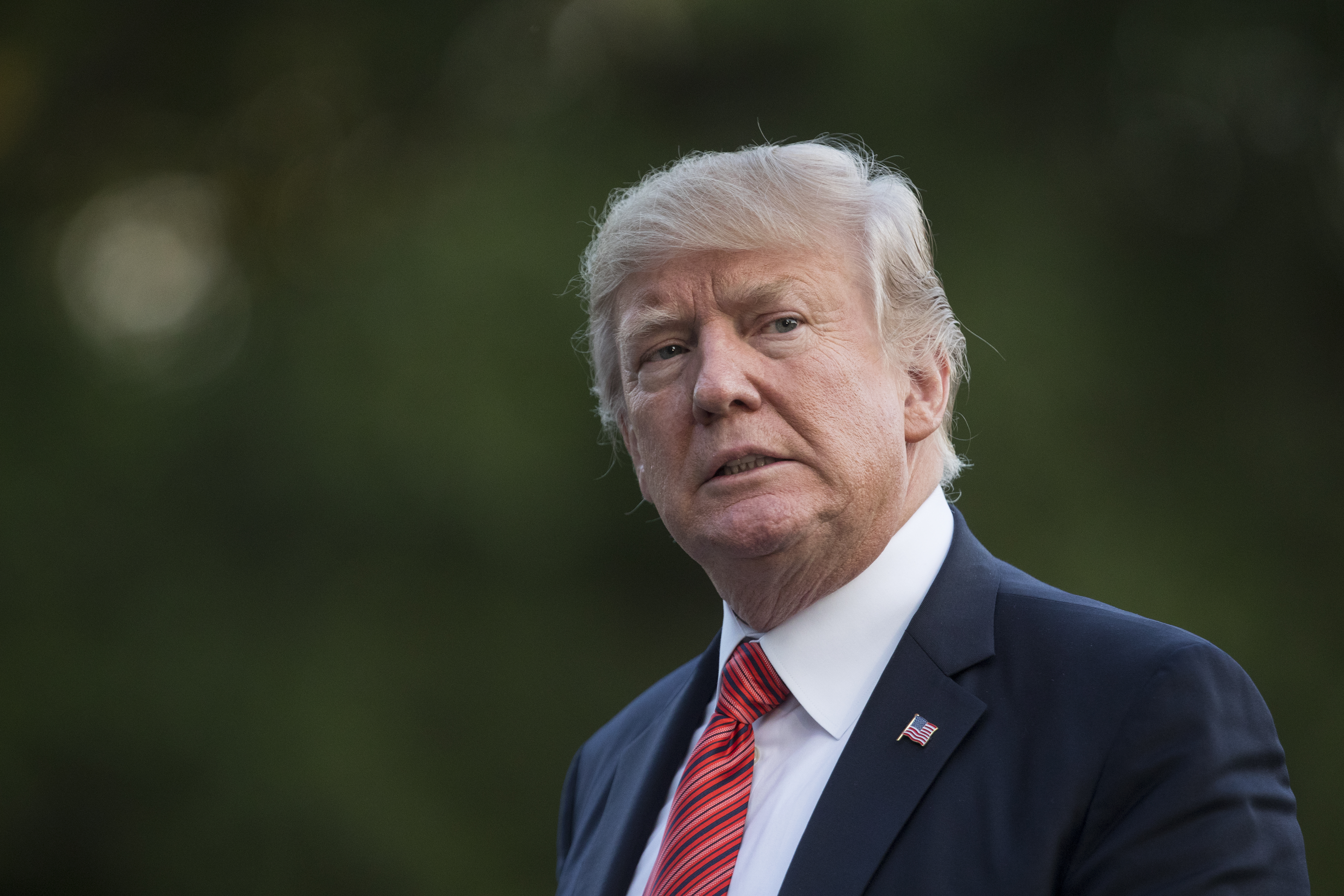 President Donald Trump walks from Marine One across the South Lawn of the White House in Washington, Wednesday, Aug. 23, 2017, as he returns from Reno, Nev. (AP Photo/Carolyn Kaster)