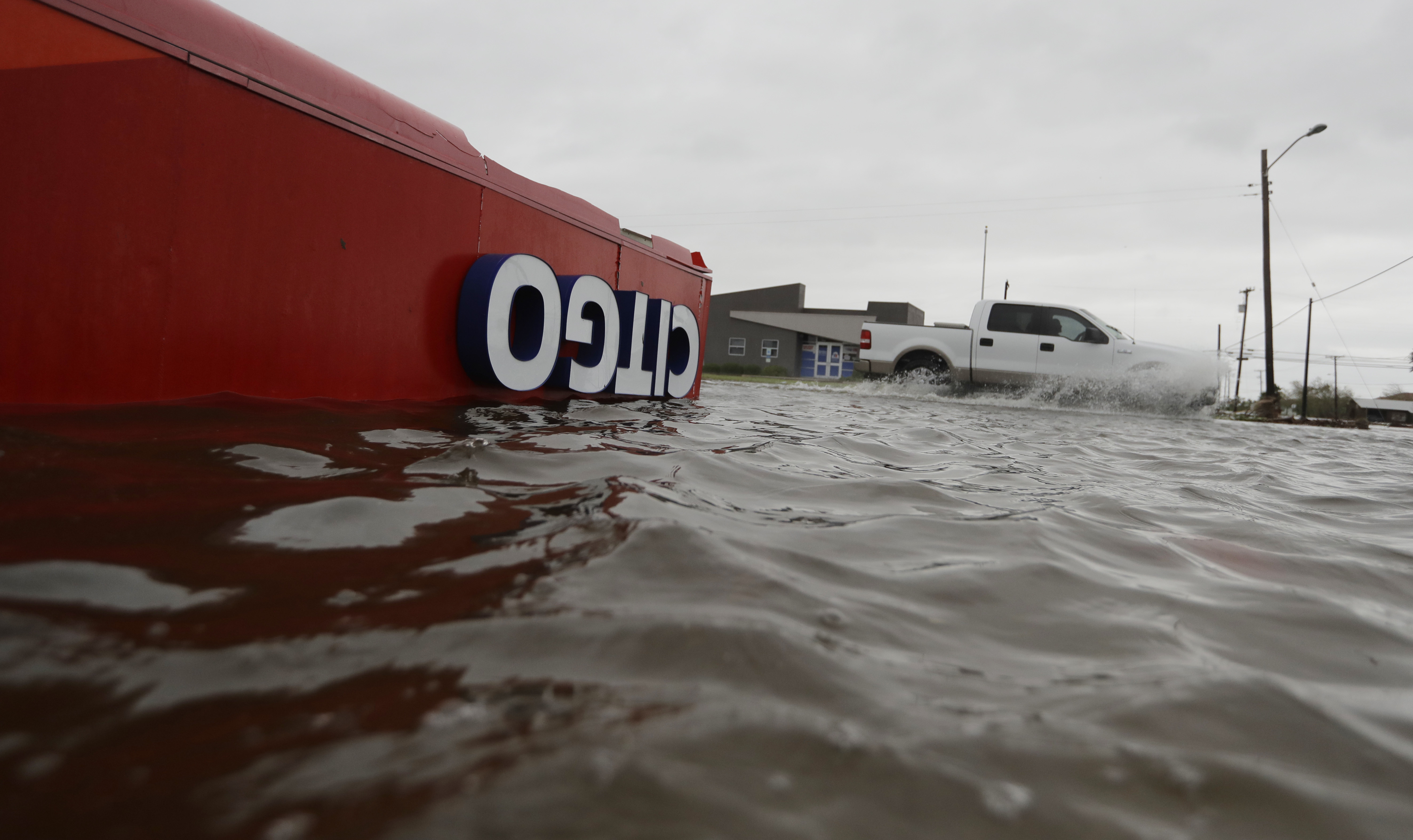 The roof of a gas station sits in flood waters in the wake of Hurricane Harvey, Saturday, Aug. 26, 2017. CREDIT: AP Photo/Eric Gay