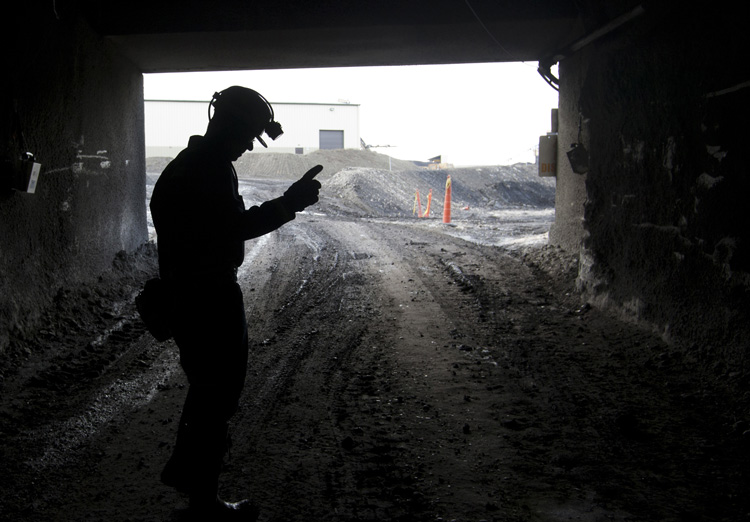 A mine employee stands in the entry of Signal Peak Energy's existing Bull Mountain mine in Montana. CREDIT: AP Photo/Janie Osborne
