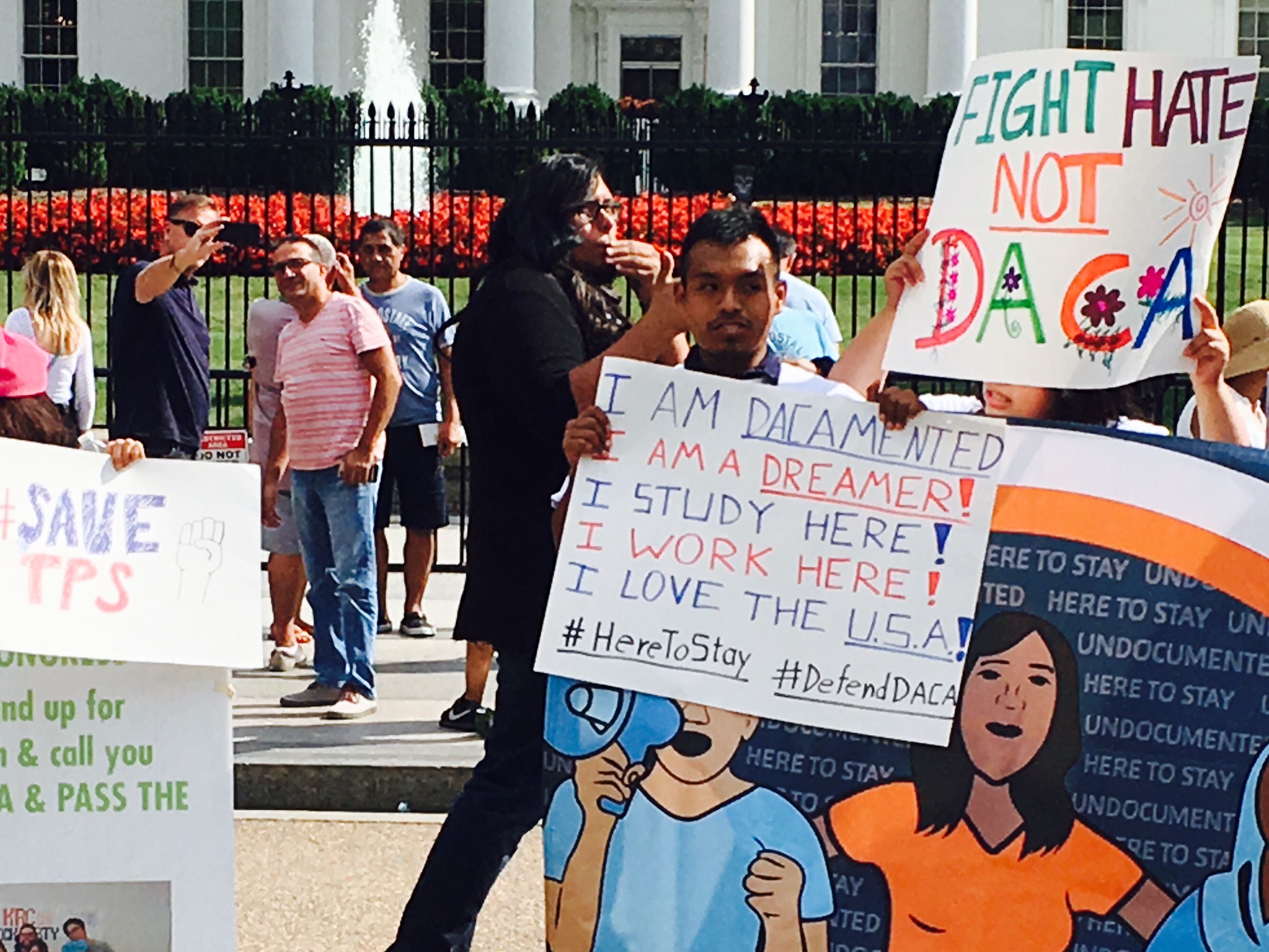 A man holds a sign during a rally for DACA on August 25, 2017. CREDIT: Esther Lee/ ThinkProgress