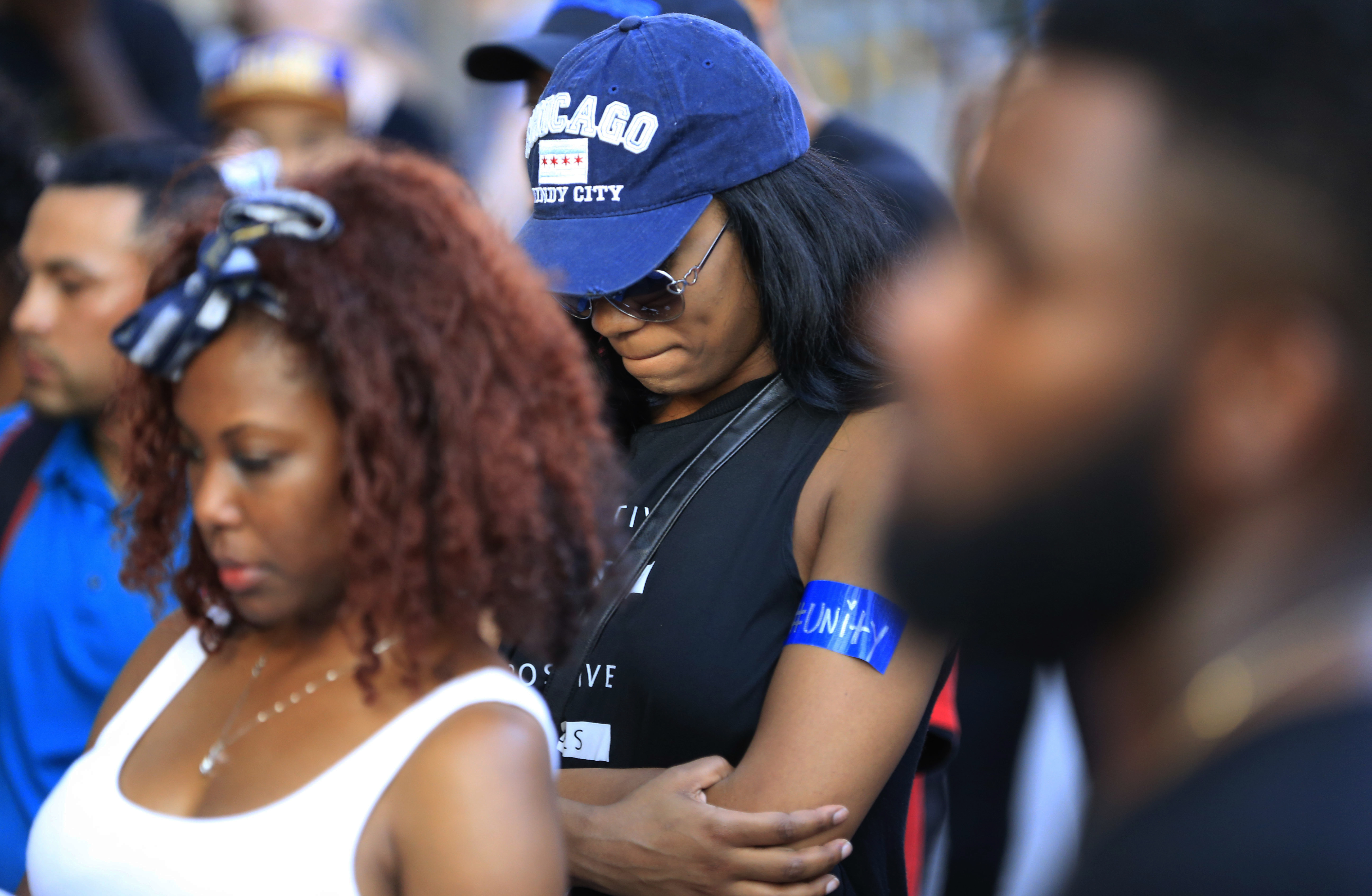 Protestors stop for a prayer during a march Friday, July 29, 2016, in Dallas. The event was organized by the same activist group that organized the July 7, protest that ended with the fatal shooting of multiple police officers. (AP Photo/Ron Jenkins)