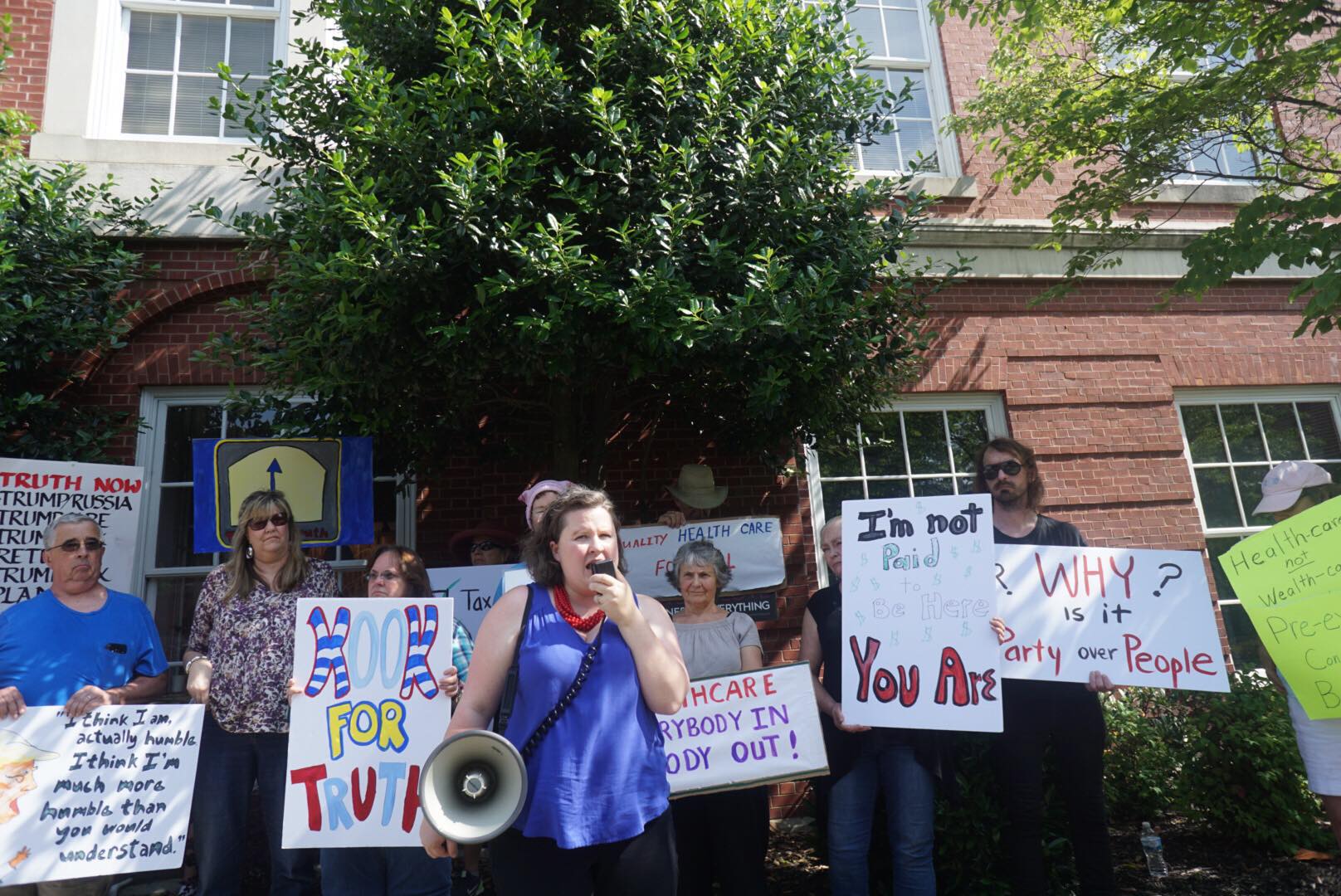 After Rep. Jimmy Duncan (R-TN) called his constituents asking for town halls "kooks," demonstrators protested outside his office holding signs reading "Kook for Truth." CREDIT: Indivisible East Tenneseee