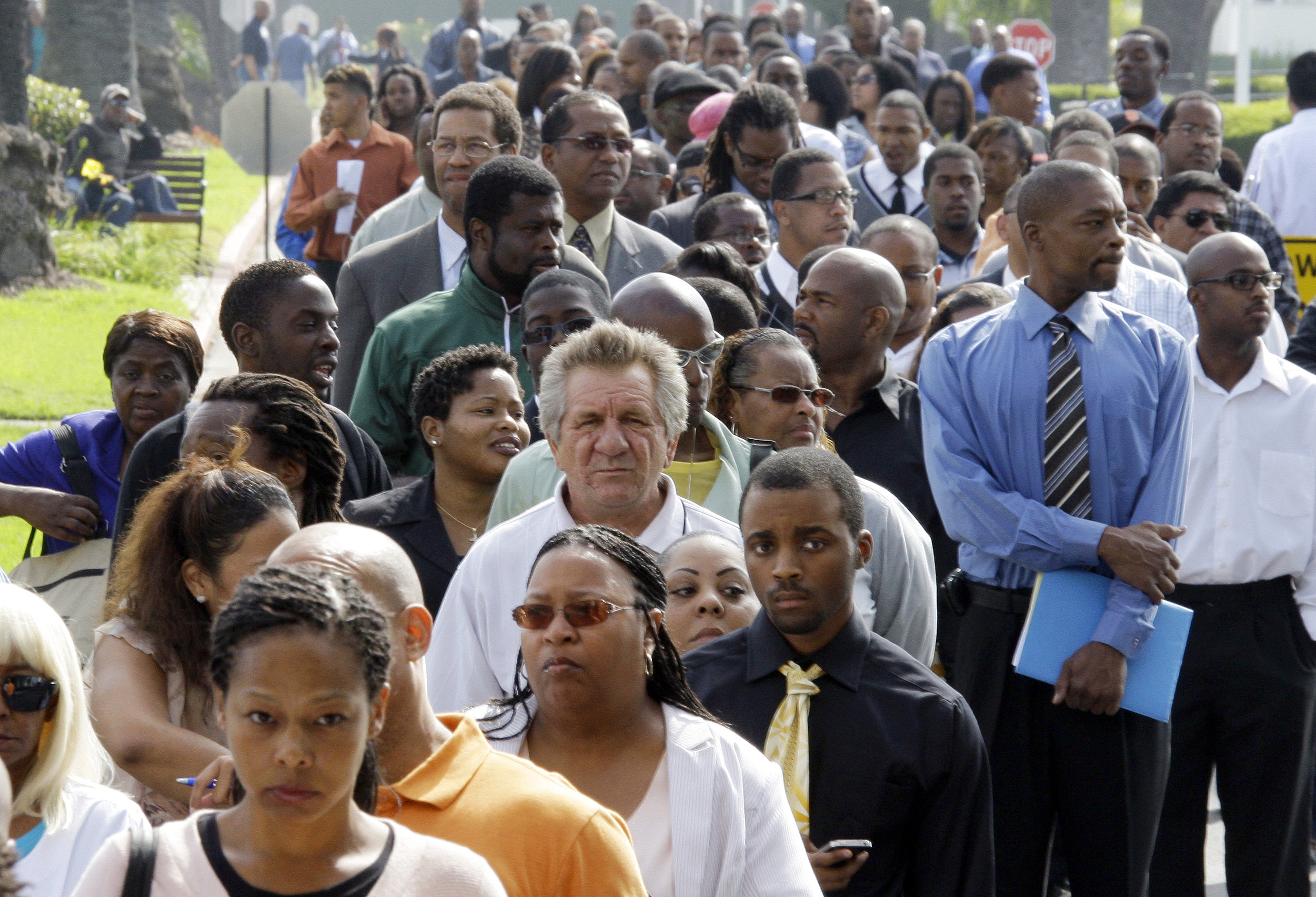 Aug. 2011 photo shows crowds of job-seekers waiting to enter a job fair at Crenshaw Christian Center in South Los Angeles. CREDIT: AP Photo/Reed Saxon, File