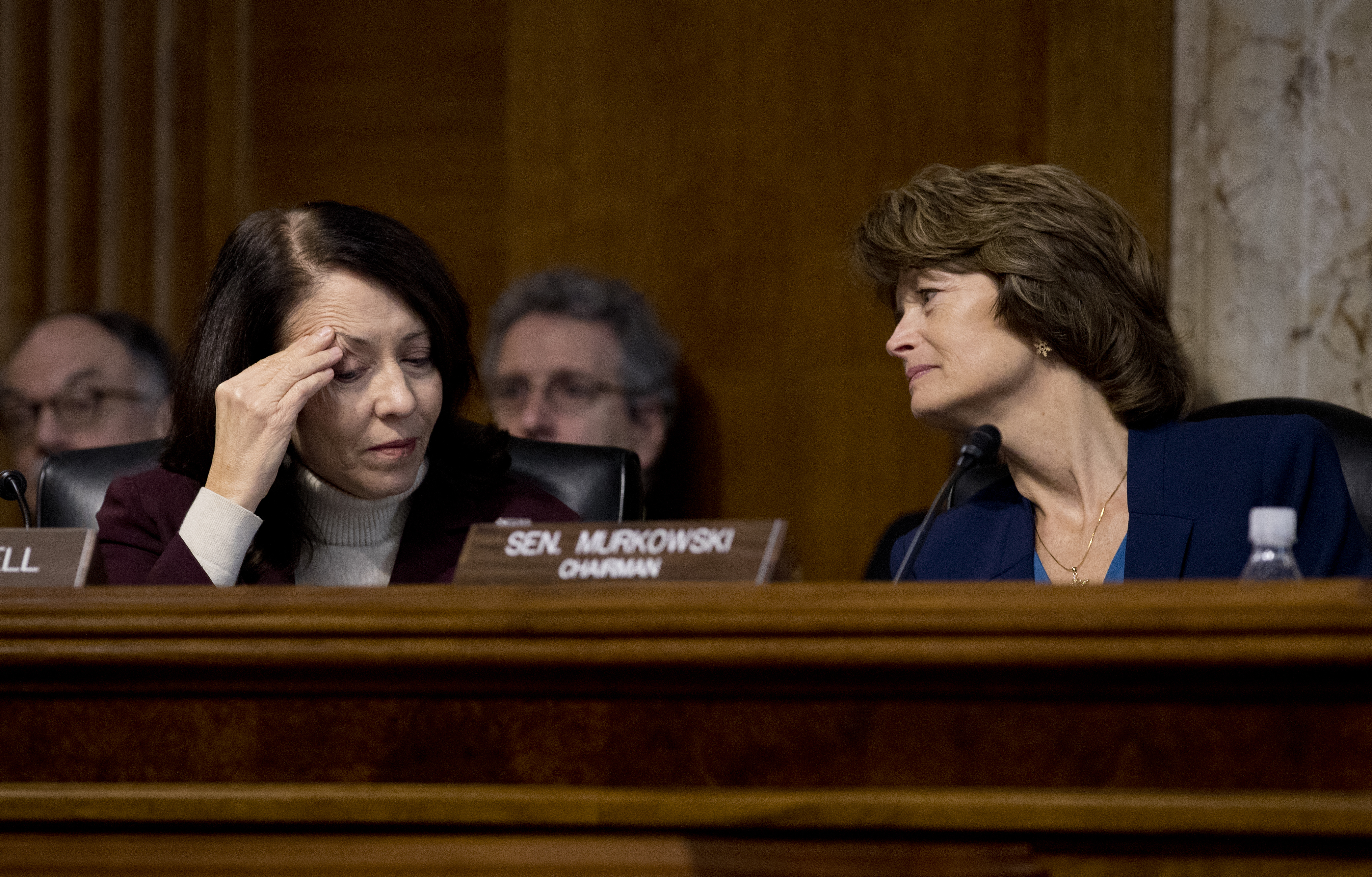 Senate Energy and Natural Resources Committee Chair Sen. Lisa Murkowski (R-AK) right, talks with the committee's ranking member Sen. Maria Cantwell, (D-WA). CREDIT: AP Photo/Carolyn Kaster