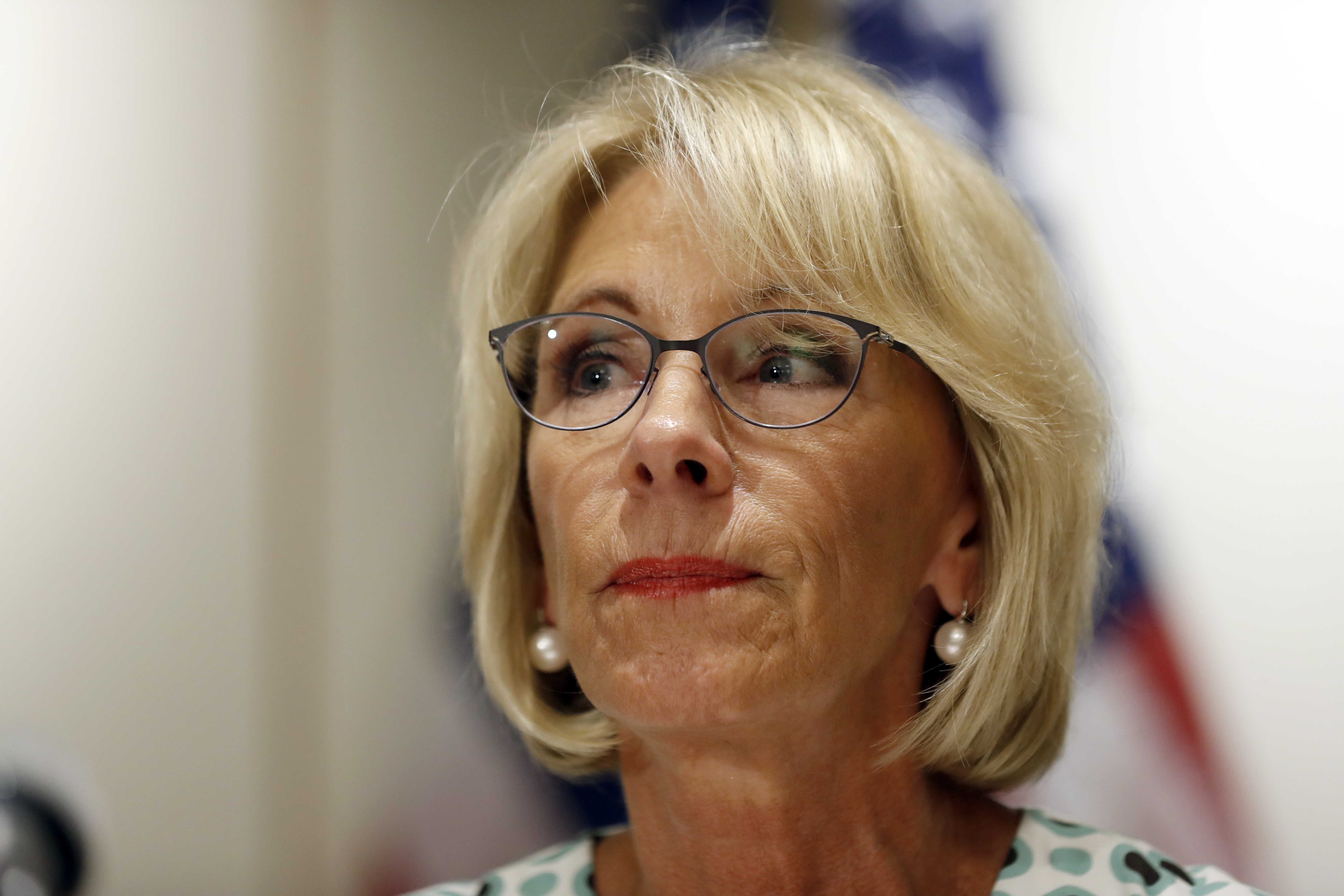 In this July 31, 2017, file photo, Education Secretary Betsy DeVos pauses while speaking with the media after a series of listening sessions about campus sexual violence in Washington, D.C. (AP Photo/Alex Brandon)