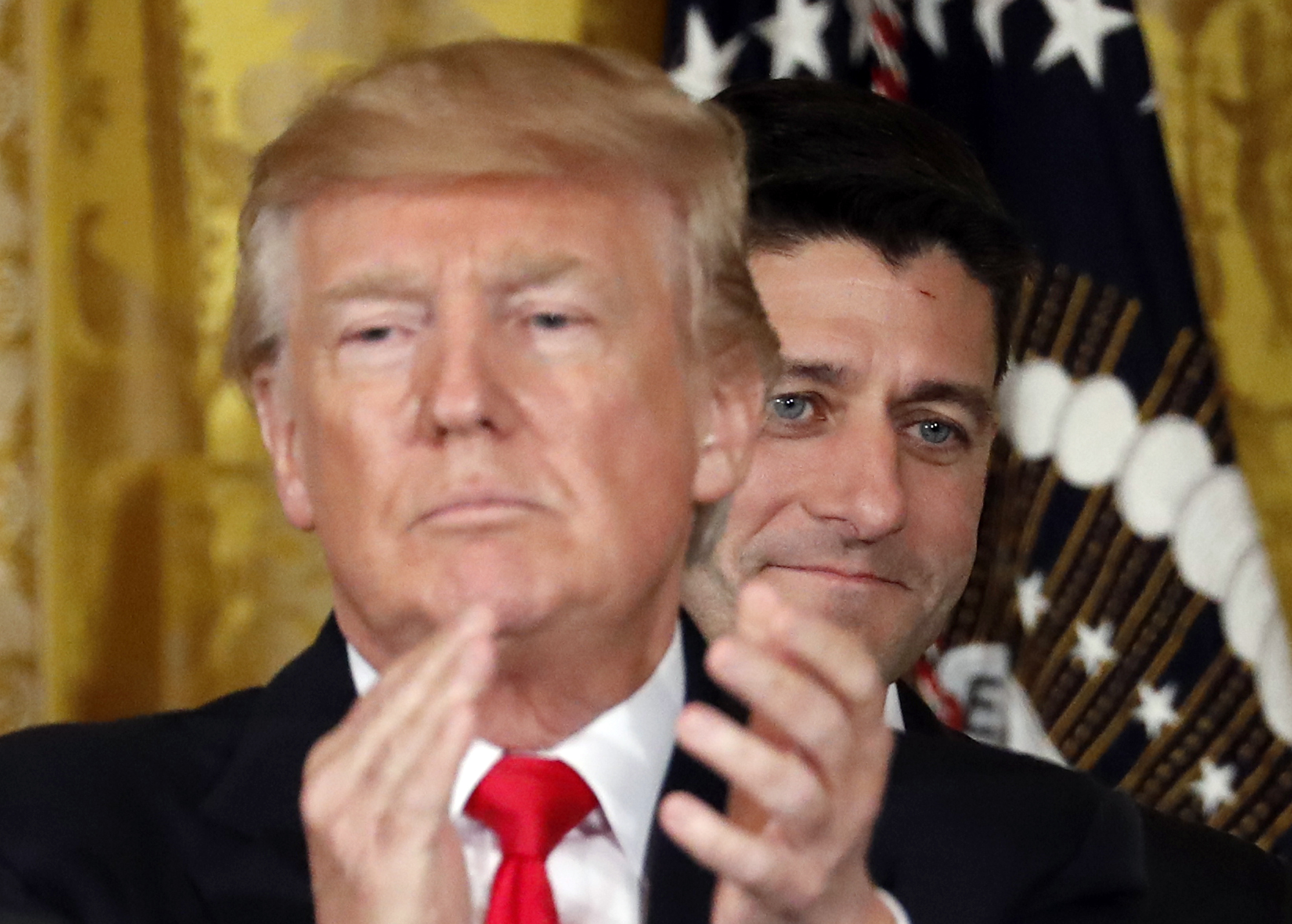 President Donald Trump applauds with House Speaker Paul Ryan of Wis., behind him in the East Room of the White House, Wednesday, July 26, 2017, in Washington. CREDIT: AP Photo/Alex Brandon