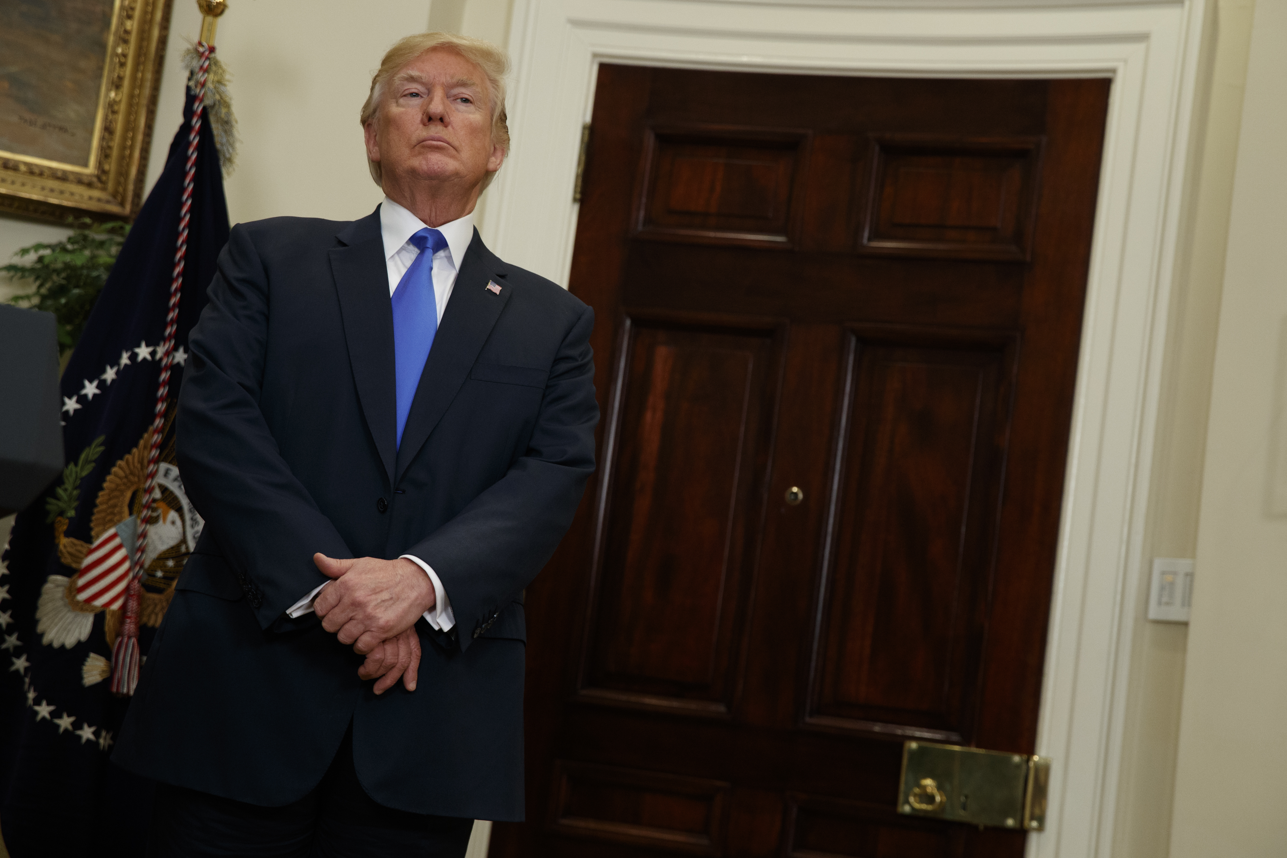 President Donald Trump listens in the Roosevelt Room of the White House in Washington, Wednesday, Aug. 2, 2017, during an event to unveil legislation that would place new limits on legal immigration. (AP Photo/Evan Vucci)