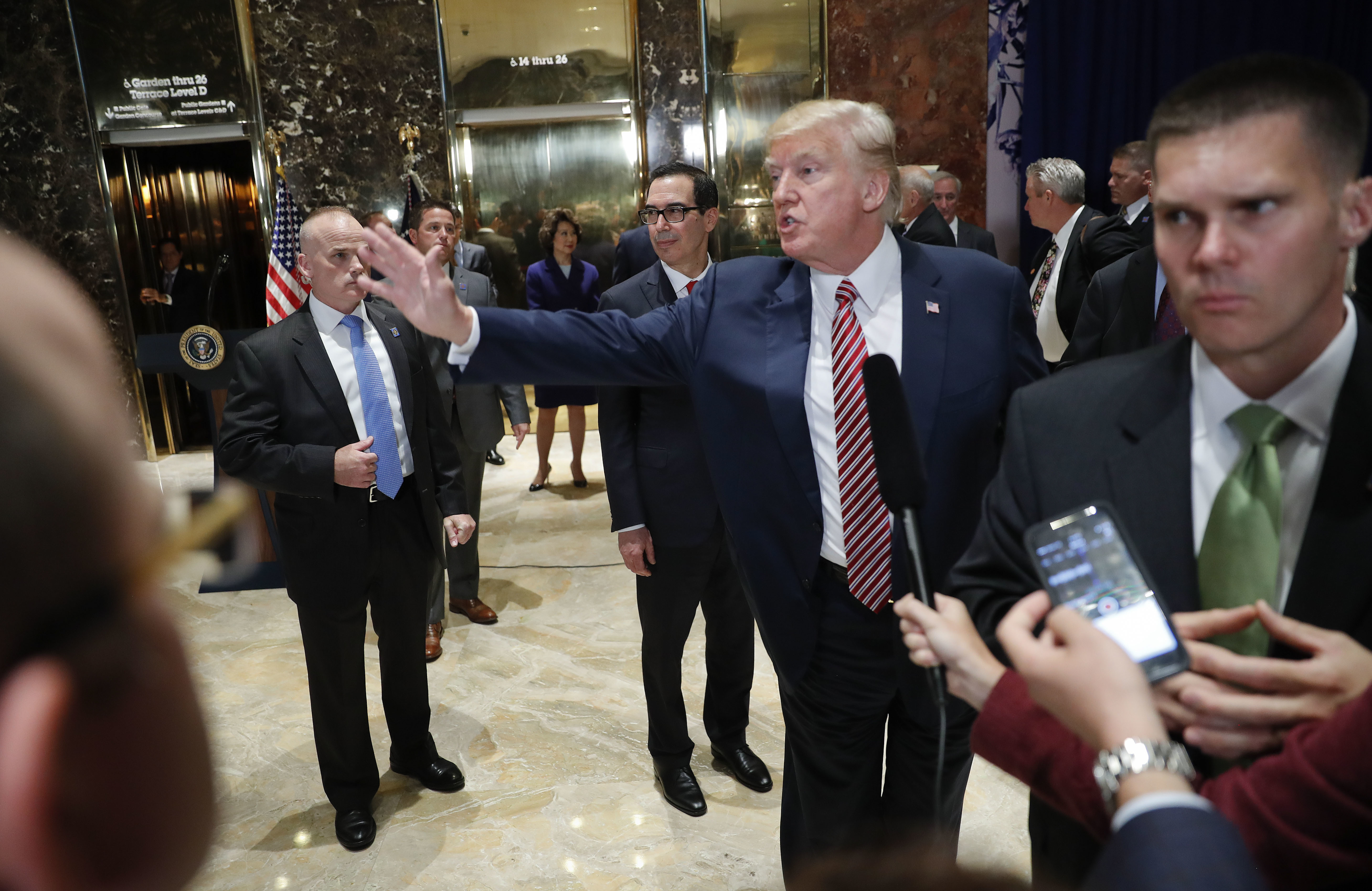 President Donald Trump gestures after speaking to the media in the lobby of Trump Tower in New York. CREDIT: AP Photo/Pablo Martinez Monsivais