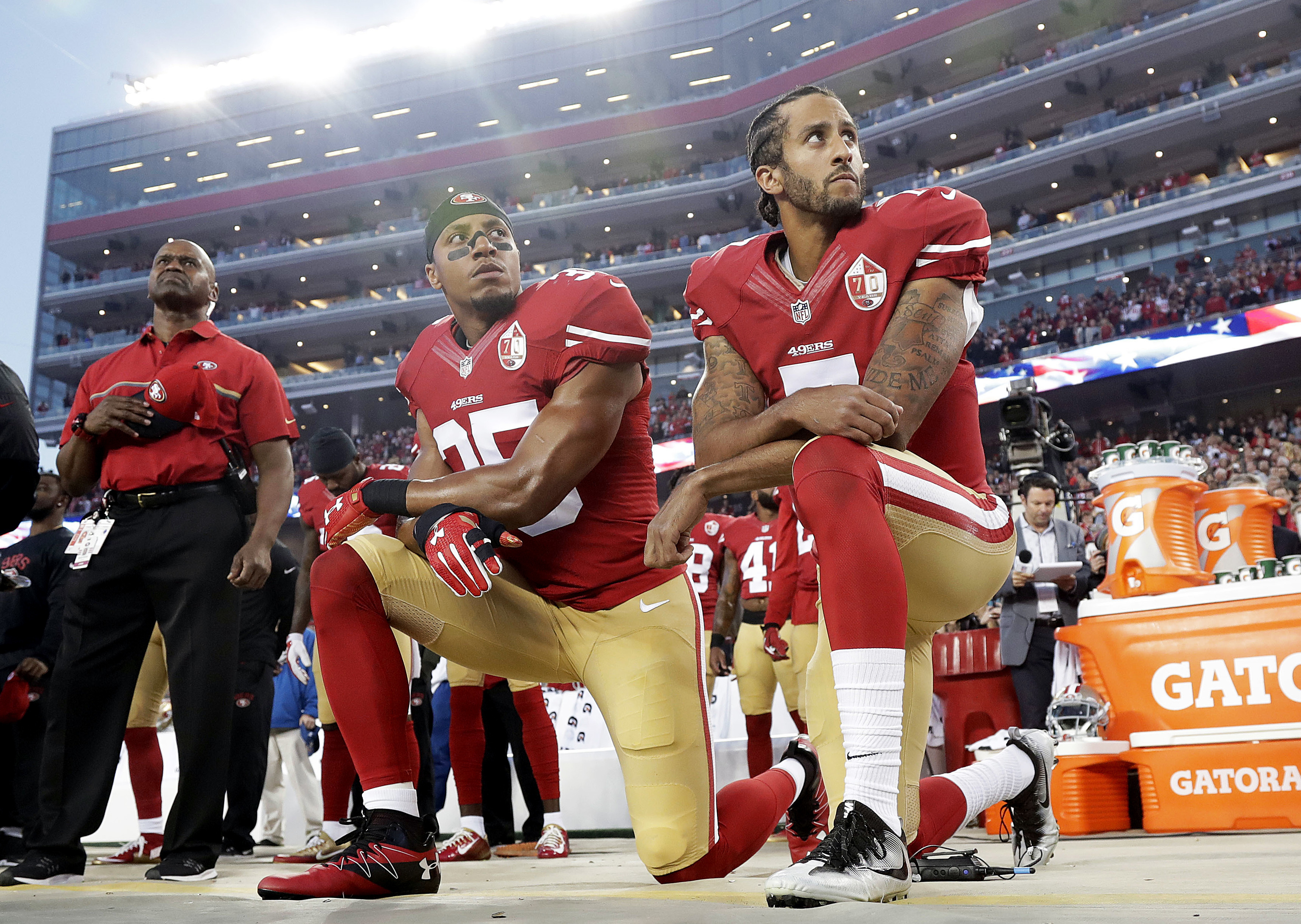 In this Monday, Sept. 12, 2016, file photo, San Francisco 49ers safety Eric Reid (35) and quarterback Colin Kaepernick (7) kneel during the national anthem before an NFL football game against the Los Angeles Rams in Santa Clara, Calif. CREDIT: AP Photo/Marcio Jose Sanchez, File