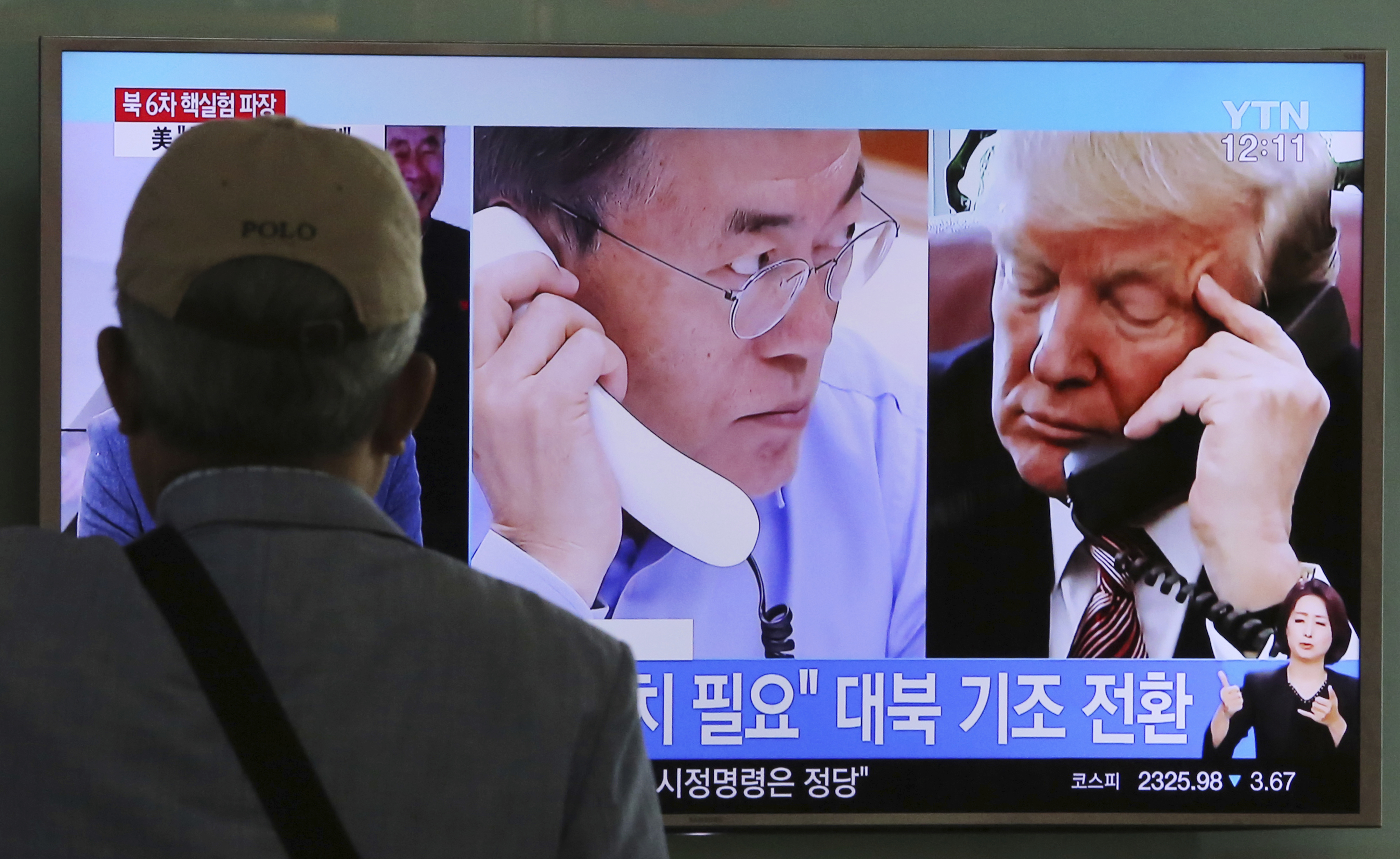 A man watches a television screen showing U.S. President Donald Trump, right, and South Korean President Moon Jae-in during a news program at the Seoul Railway Station in Seoul, South Korea. CREDIT: AP Photo/Ahn Young-joon