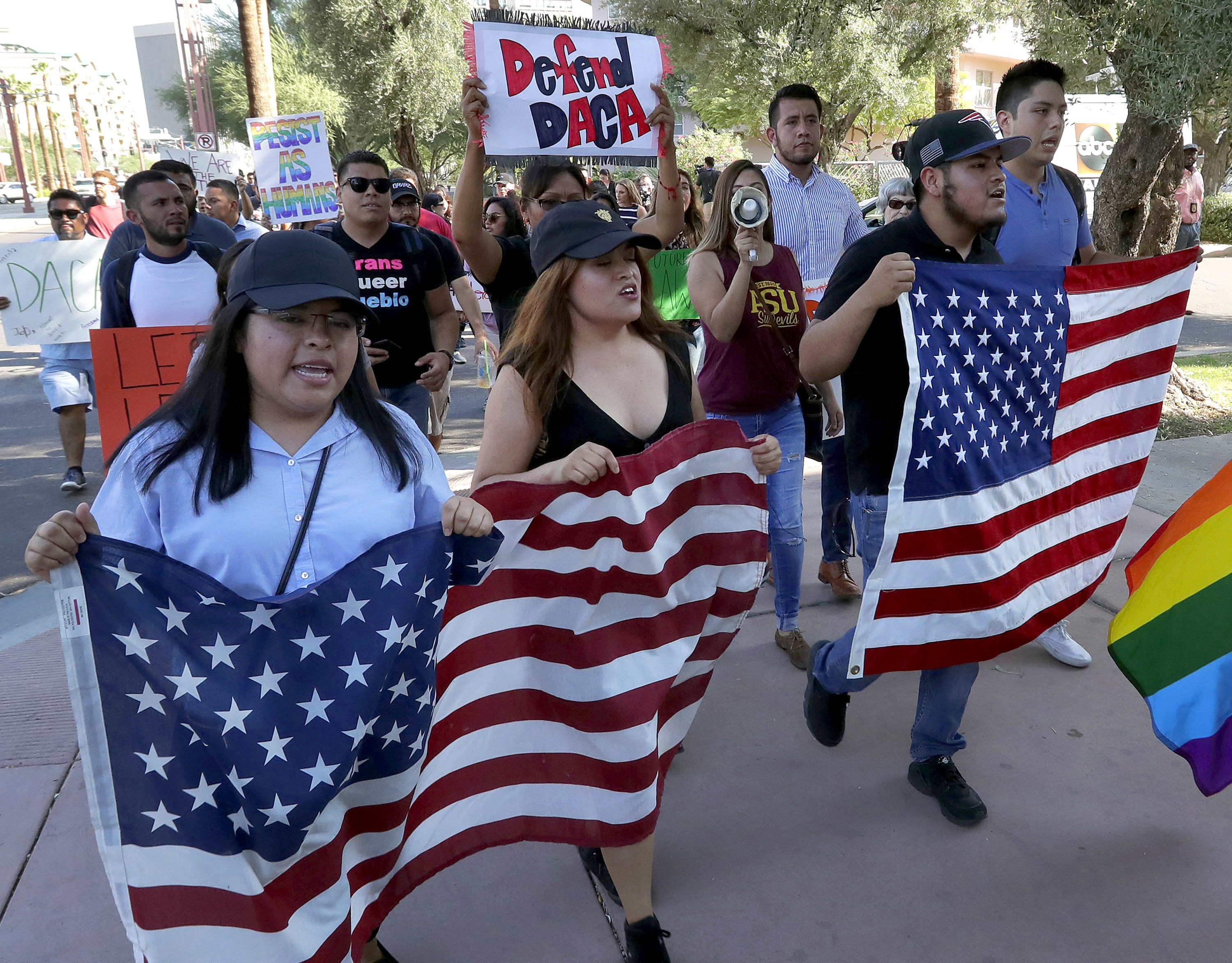 Deferred Action for Childhood Arrivals (DACA) supporters march to the Immigration and Customs Enforcement office to protest shortly after U.S. Attorney General Jeff Sessions' announcement that the Deferred Action for Childhood Arrivals (DACA), will be suspended with a six-month delay, Tuesday, Sept. 5, 2017, in Phoenix. CREDIT: AP Photo/Matt York