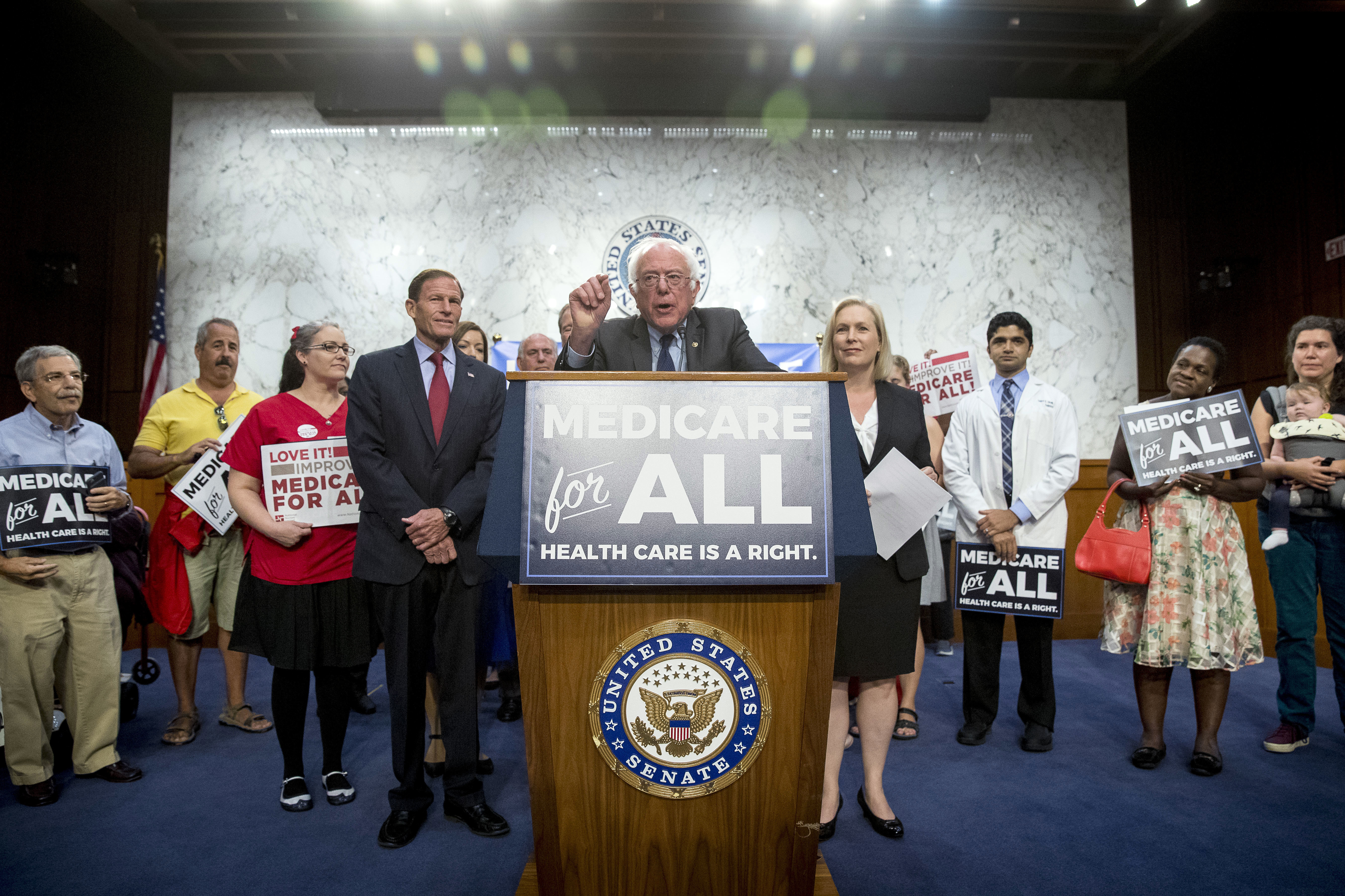 Sen. Bernie Sanders, I-Vt., center, joined by Sen. Richard Blumenthal, D-Conn., center left, Sen. Kirsten Gillibrand, D-N.Y., center right, and supporters, speaks at a news conference on Capitol Hill in Washington, Wednesday, Sept. 13, 2017, to unveil their Medicare for All legislation to reform health care. CREDIT: AP Photo/Andrew Harnik