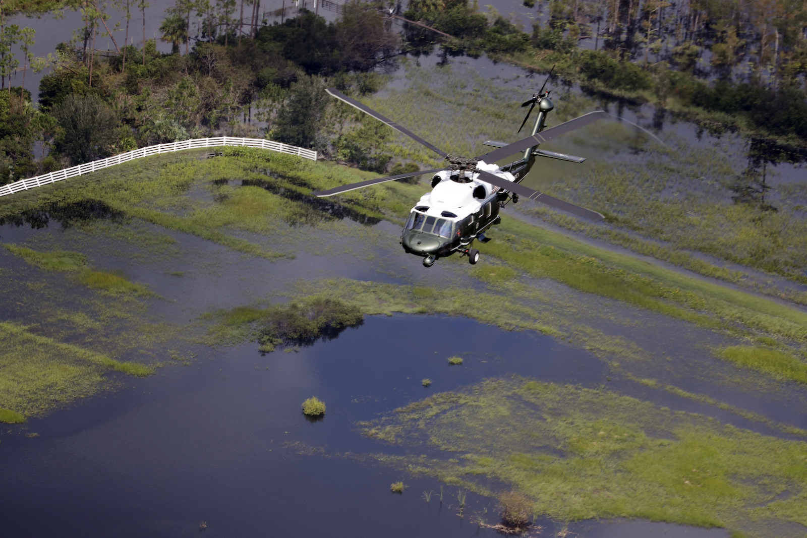 Marine One, with President Trump aboard, flies over areas hit by Hurricane Irma, September 14, 2017. CREDIT: AP/Evan Vucci