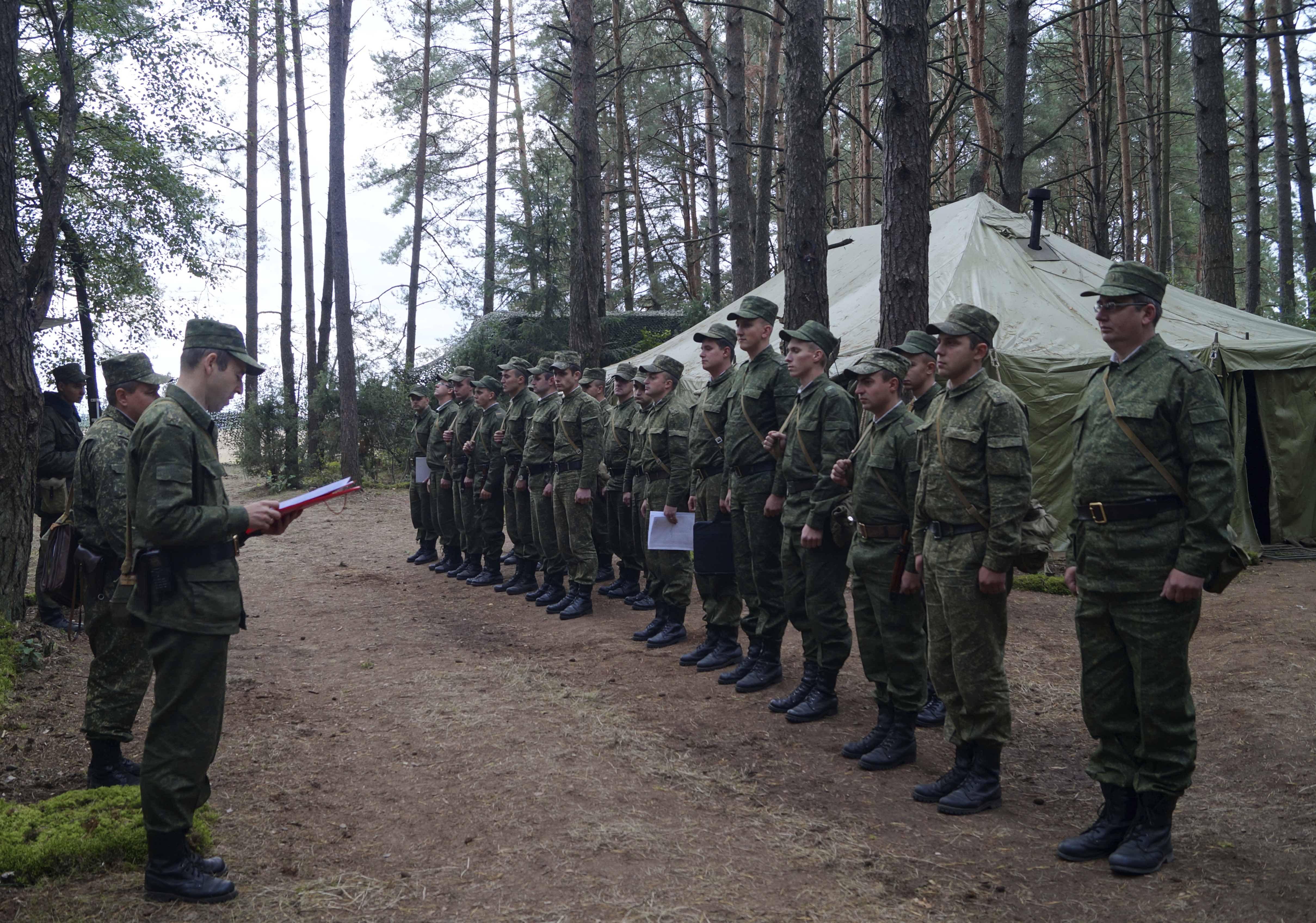 Belarus' Col.Alexander Prokopenko, left, reads his order to start the drills at a training ground at an undisclosed location in Belarus on Thursday, Sept. 14, 2017. CREDIT: Vayar Military Agency photo via AP