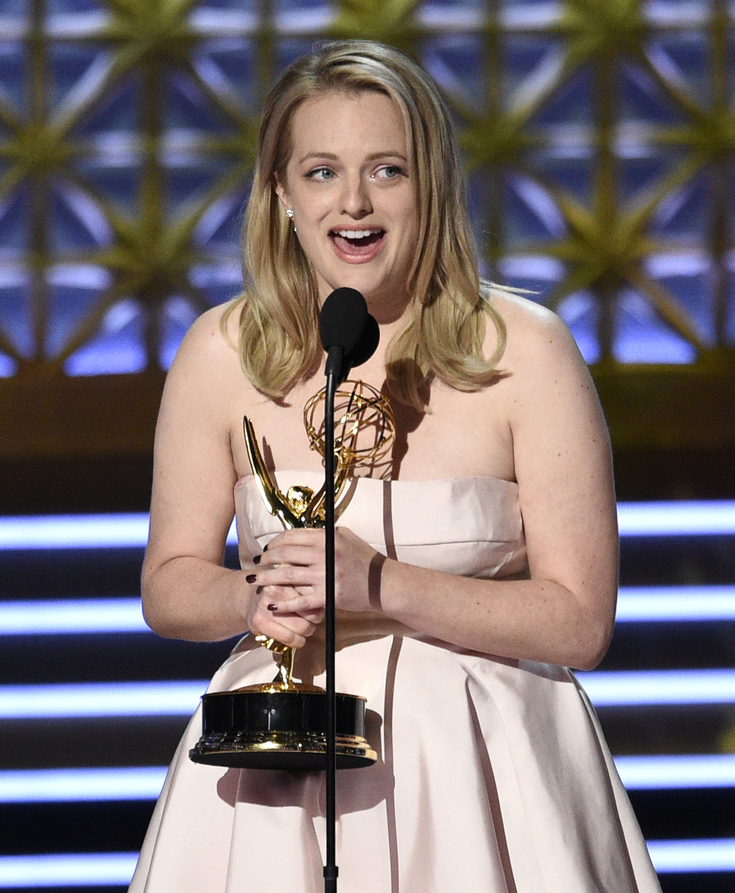 Elisabeth Moss accepts the award for outstanding lead actress in a drama series for "The Handmaid's Tale" at the 69th Primetime Emmy Awards on Sunday, Sept. 17, 2017. CREDIT: Photo by Chris Pizzello/Invision/AP