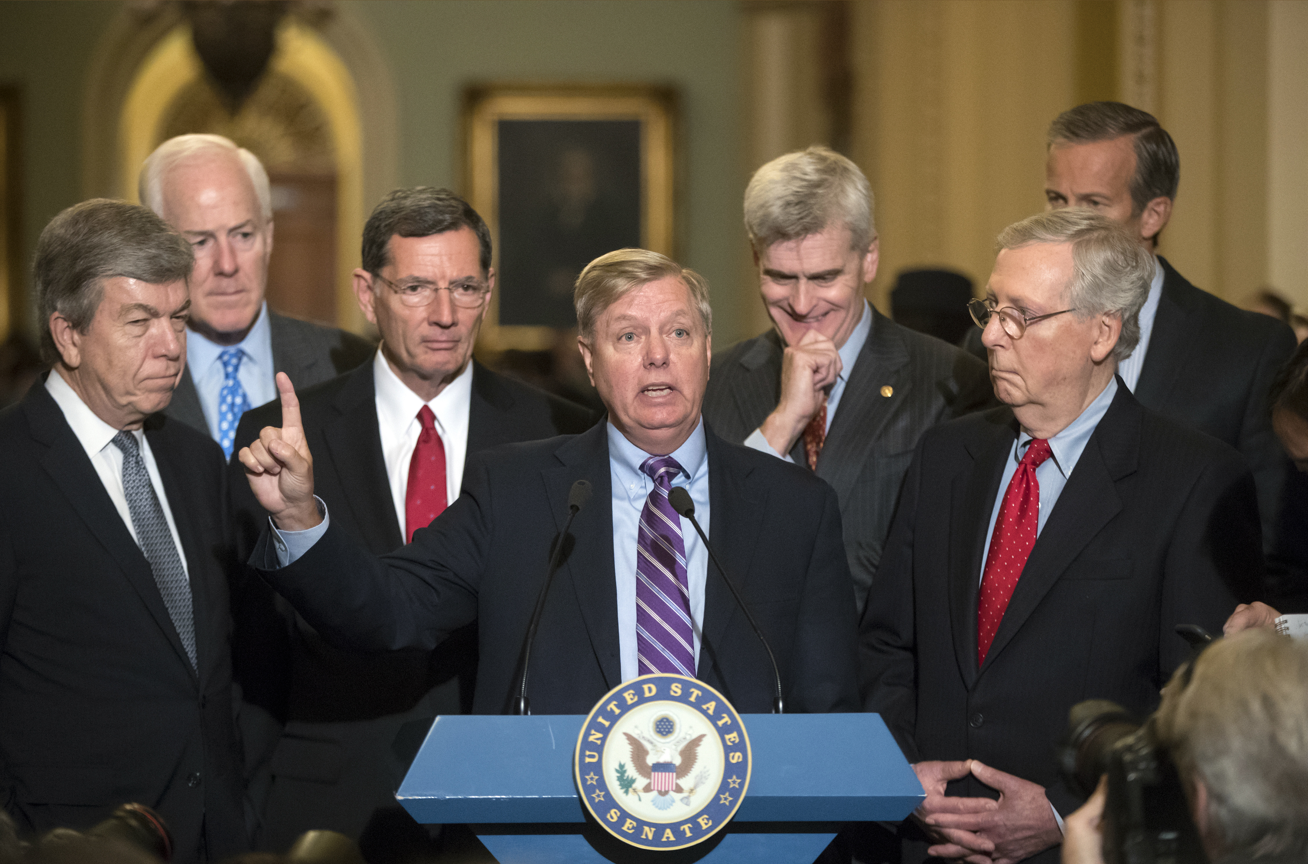 Sen. Lindsey Graham, R-S.C., joined by, from left, Sen. Roy Blunt, R-Mo., Majority Whip John Cornyn, R-Texas, Sen. John Barrasso, R-Wyo., Sen. Bill Cassidy, R-La., Senate Majority Leader Mitch McConnell, R-Ky., and Sen. John Thune, R-S.D. Tuesday, Sept. 19, 2017. CREDIT: AP Photo/J. Scott Applewhite