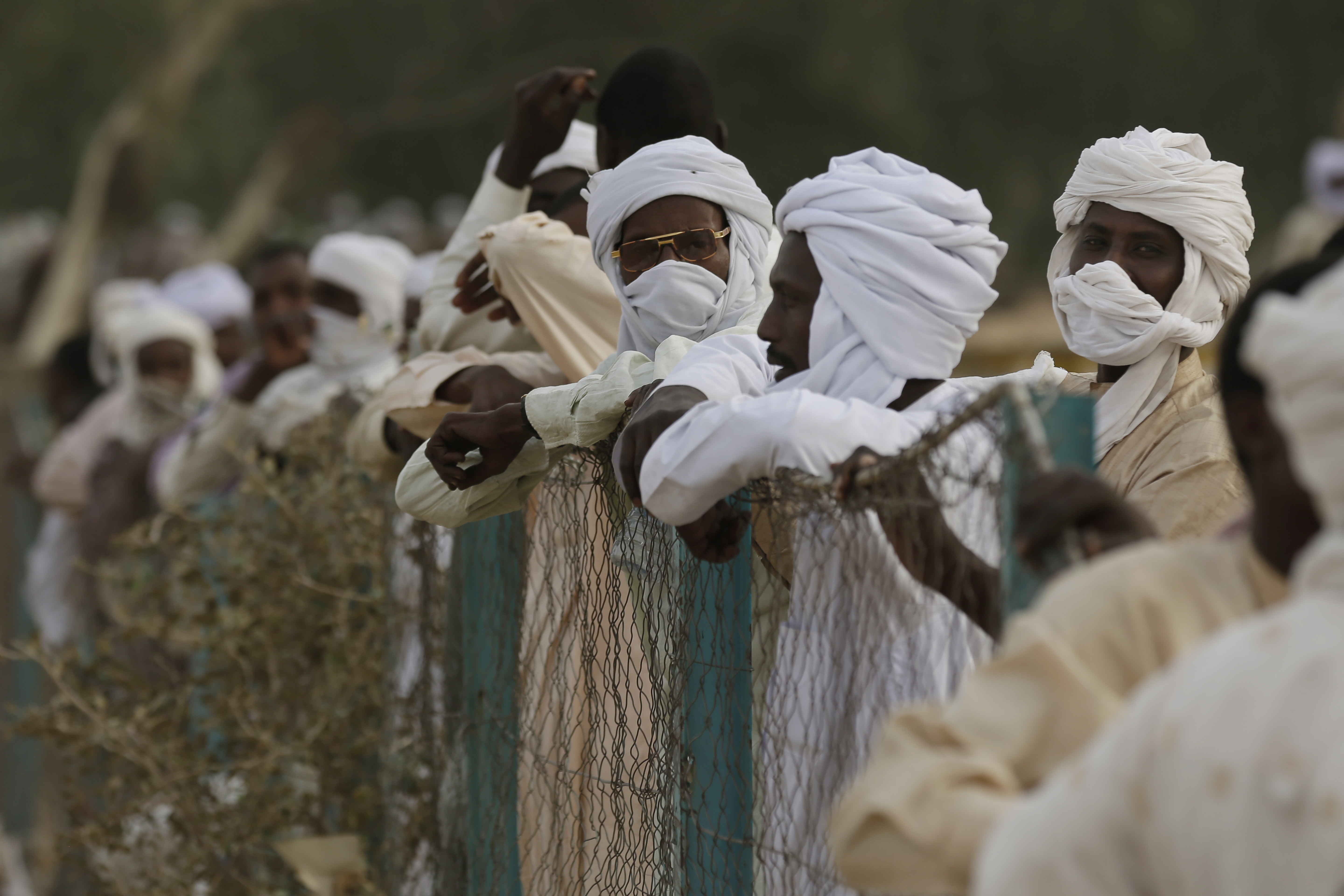 Spectators watch Chadian jockeys race to the finish line during an afternoon of races at the hippodrome in N'djamena, Chad, Sunday March 15, 2015. CREDIT: AP Photo/Jerome Delay